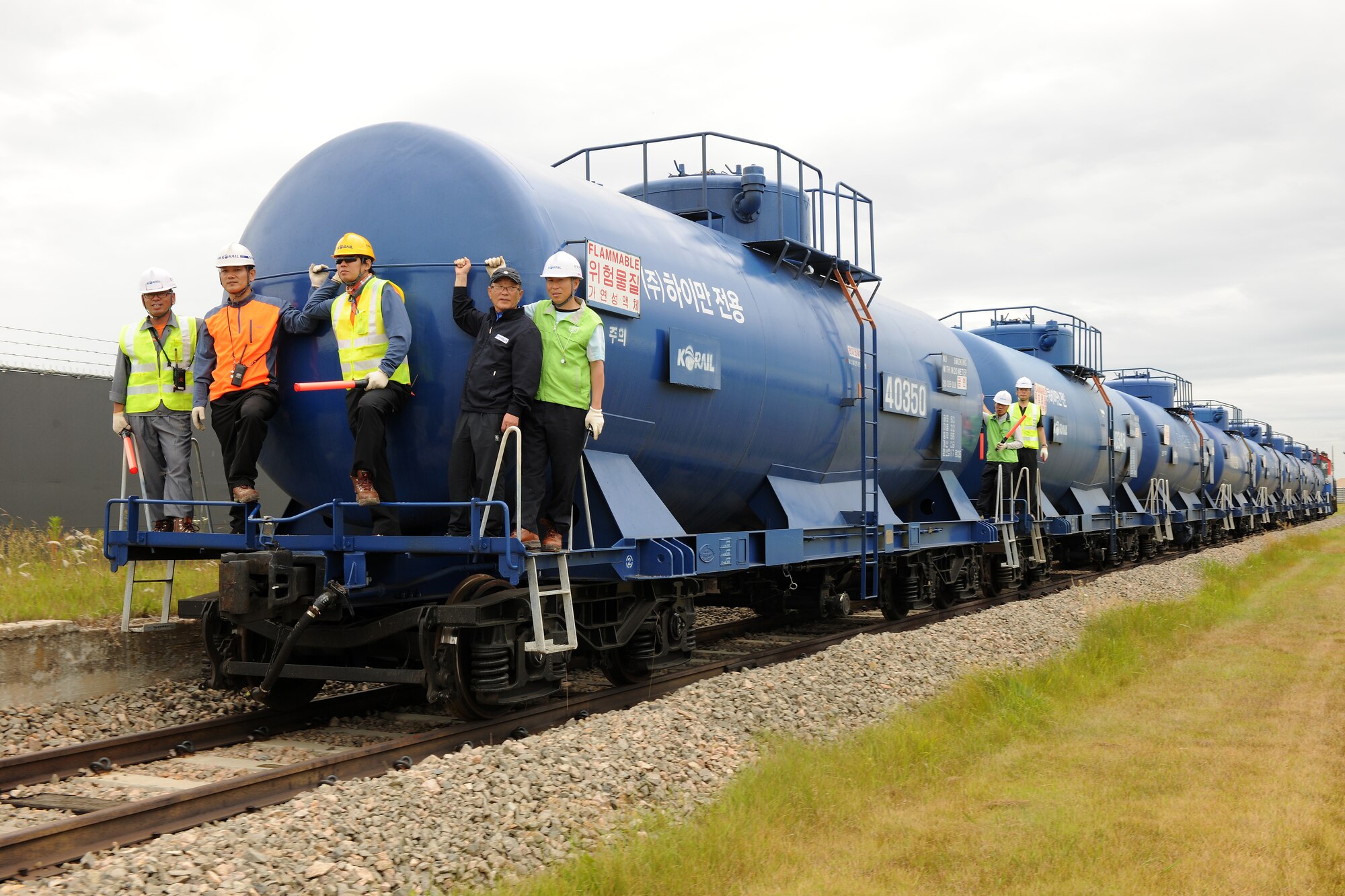 KUNSAN AIR BASE, Republic of Korea -- KORAIL employees rides a train onto base here June 22. This was the first train to enter base using the storage rail system in more than a decade. (U.S. Air Force photo/Senior Airman Ciara Wymbs)