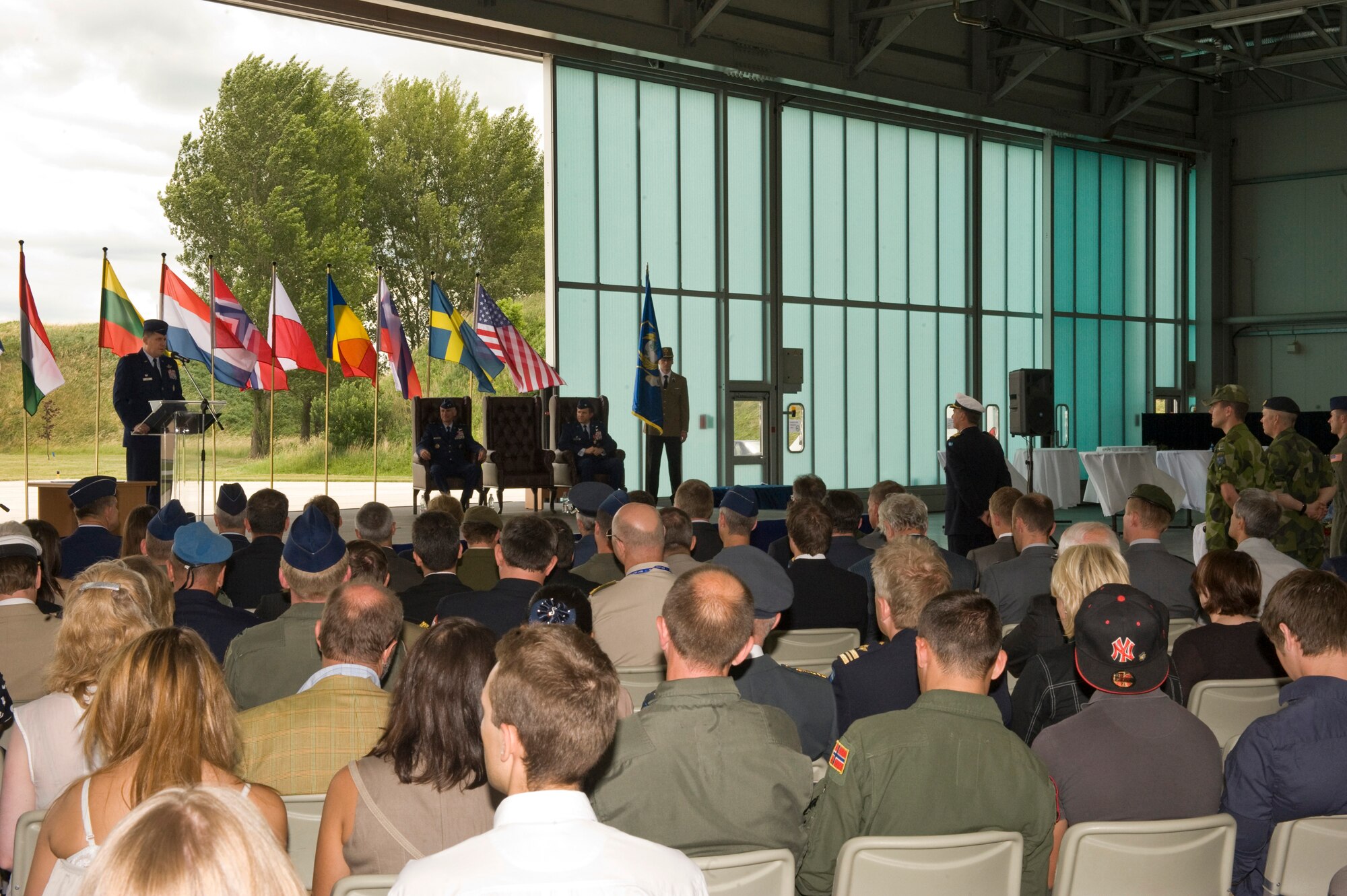 U.S. Air Force Col. Keith Boone, multinational Heavy Airlift Wing (HAW) commander, addresses the crowd after taking command during the first HAW Change of Command ceremony, Papa Air Base, Hungary, June 17, 2011. (U.S. Air Force photo/TSgt Wayne Clark, AFNE Regional News Bureau) (Released)