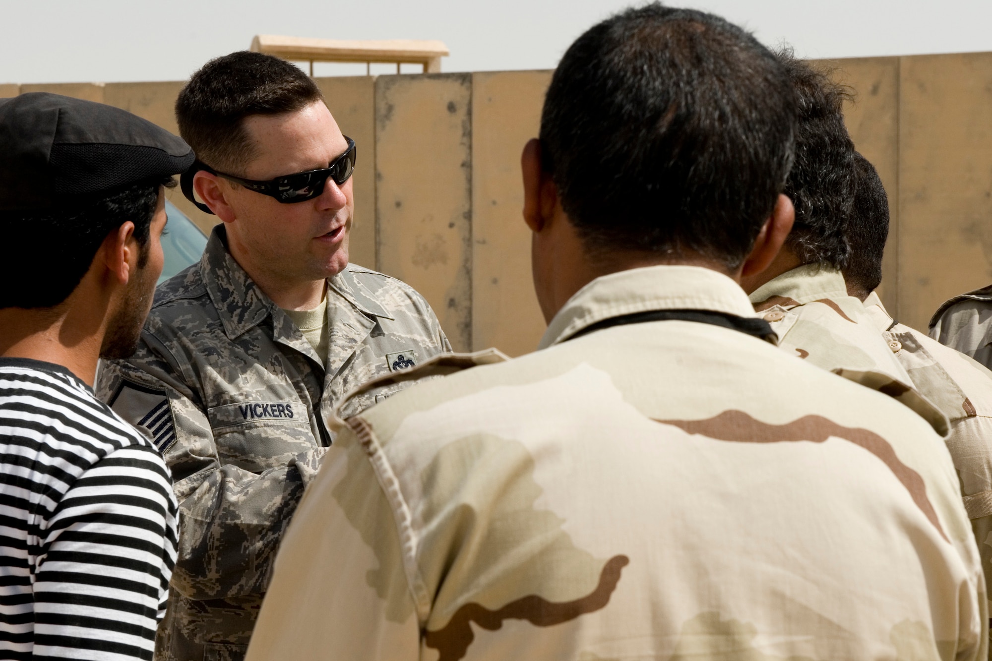 Ali Air Base, Iraq -- Master Sergeant Timothy Vickers, 321st Expeditionary Mission Support Advisory Group advisor, instructs Iraqi firefighters on driving the 'crash truck' June 13. Sergeant Vickers assisted the 407th Expeditionary Operation Support Squadron fire department in training 15 Iraqi firefighters on the basics of fighting fires to prepare them for the U.S. transition in December. Sergeant Vickers is deployed from Aviano Air Base, Italy, and is a native of Ridgecrest, Calif. (U.S. Air Force photo by Staff Sgt. Levi Riendeau)