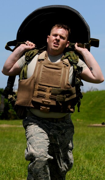 Staff Sgt. Ryan Hemenway, 18th Logistic Readiness Squadron Fuel Service Center supervisor and Forward Area Refueling Point tryouts competitor, carries a 200-pound, 300-foot fuel hose to the finish as part of the FARP tryouts on Kadena Air Base, Japan, June 17. Eight competitors were tested physically in the obstacle course and academically in the written test portion, before going before a board of the current team members in an attempt to join the ranks of the few fuels special operations Airmen. (U.S. Air Force photo/Airman 1st Class Maeson L. Elleman)