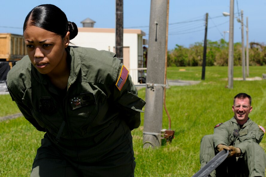 Staff Sgt. Shawnika Danielson, 18th Logistic Readiness Squadron Forward Area Refueling Point team member, squeegees a fuel hose during the demonstration portion of the FARP tryouts on Kadena Air Base, Japan, June 17. During the tryouts, 18th LRS Airmen looking for the thrill of fuels special operations were put to the test physically in a sort of obstacle course, and academically in a written test, before going before a board of the current team members to compete for the highly sought-after job. (U.S. Air Force photo/Airman 1st Class Maeson L. Elleman)