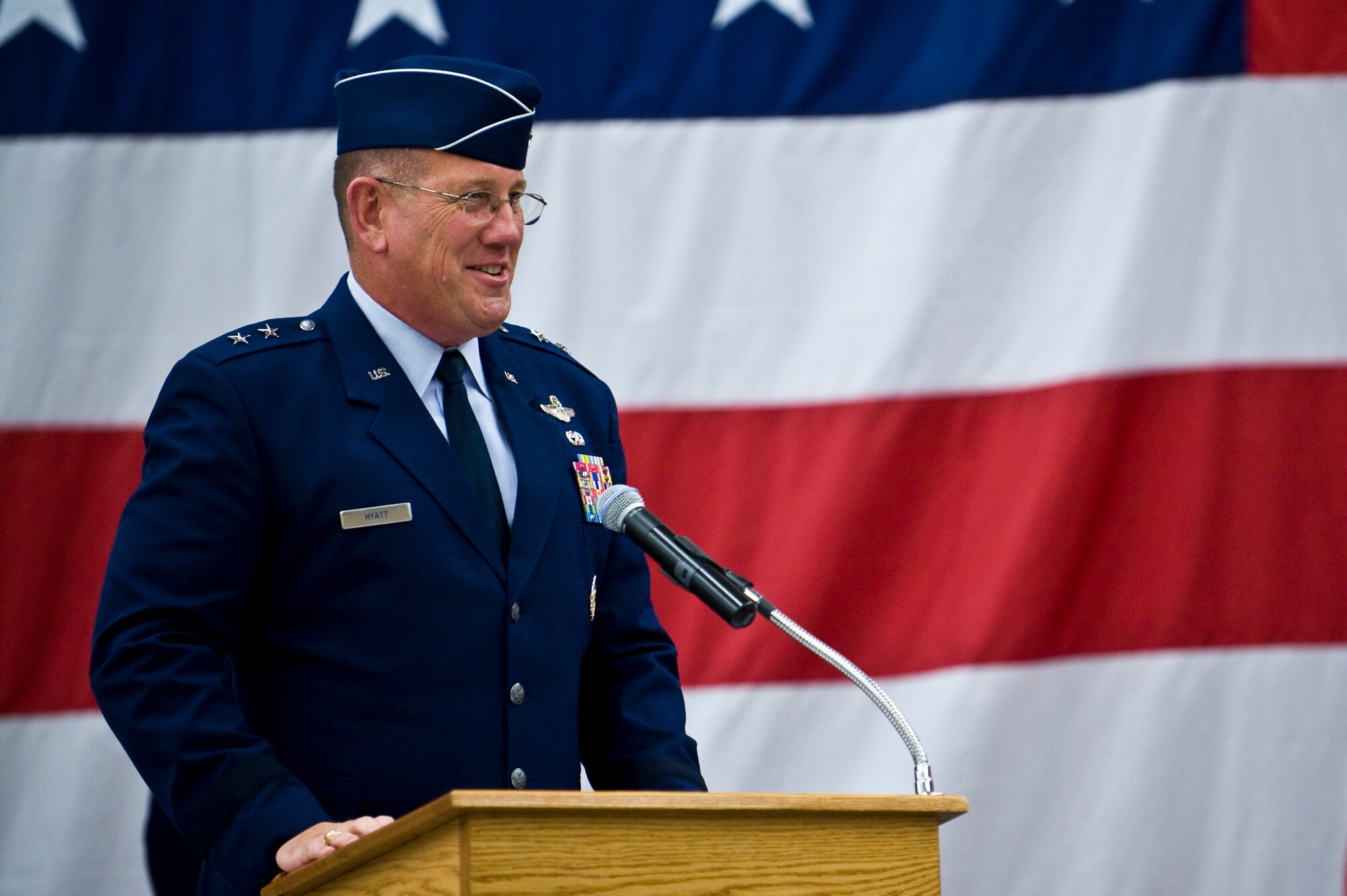 U.S. Air Force Maj. Gen. Bill Hyatt, U.S. Air Force Warfare Center commander, recognizes the contributions of the men and women of the 98th Range Wing during a ceremony re-designating the unit The Nevada Test and Training Range at Nellis Air Force Base, Nev., June 21, 2011. Col. Kenneth Thompson, former defense and air attaché to the U.S. Embassy in Cairo, assumed command of the NTTR during the event. Like the 98 RANW, The NTTR will remain a direct reporting unit to the U.S. Air Force Warfare Center and continue to operate, maintain and manage the 2.9-million-acre range (42 percent of the land managed by the U.S. Air Force) and 12,000 square miles of military airspace. More than 1,000 military, civilian and contract personnel are assigned to the organization. (U.S. Air Force photo by Senior Airman Brett Clashman/Released)