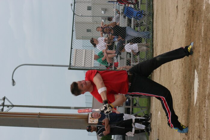 Bruce L. Best Jr., Team Torii short stop, swings with all his might during Team Torii’s close nail-biting 8-7 win against the CLC-36 Dragons in an intramural softball game at the Penny Lake softball fields here June 22. Both teams stepped up late in the game to keep the score close, making spectacular diving catches.