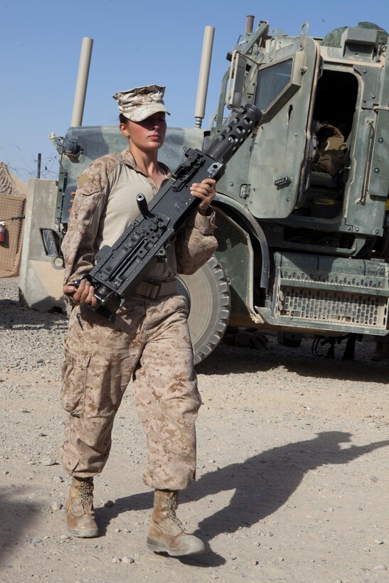 Lance Cpl. Jessica Craver, a motor transportation operator with Combat Logistics Battalion 7, carries a .50-caliber machine gun barrel for mounting onto an MK48 Logistics Vehicle System prior to convoy operations from Camp Dwyer to Camp Leatherneck, Afghanistan, June 23. CLB-7 along with Marine Wing Support Squadron 272 provided assistance in retrograding gear for Marine Unmanned Aerial Vehicle Squadron 3 to their new location at Camp Leatherneck.