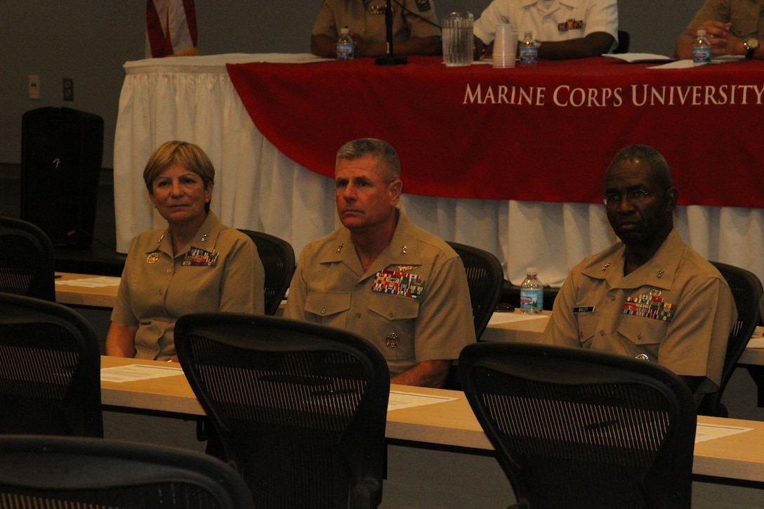 Maj. Gen. Angela Salinas, director, Manpower Management Division, Manpower and Reserve Affairs, Maj. Gen.Thomas Murray, president, Marine Corps University, and Maj. Gen. Ronald Bailey, commanding general, Marine Corps Recruiting Command, listen to questions from the audience during the Marine Corps Leadership Seminar. The attendance of three major generals, the university president of Harris-Stowe State University, and other honored guests made a larger impact than in years past, a trend the guest speaker, retired Maj. Gen. Arnold Palmer, hopes will continue in the years ahead.