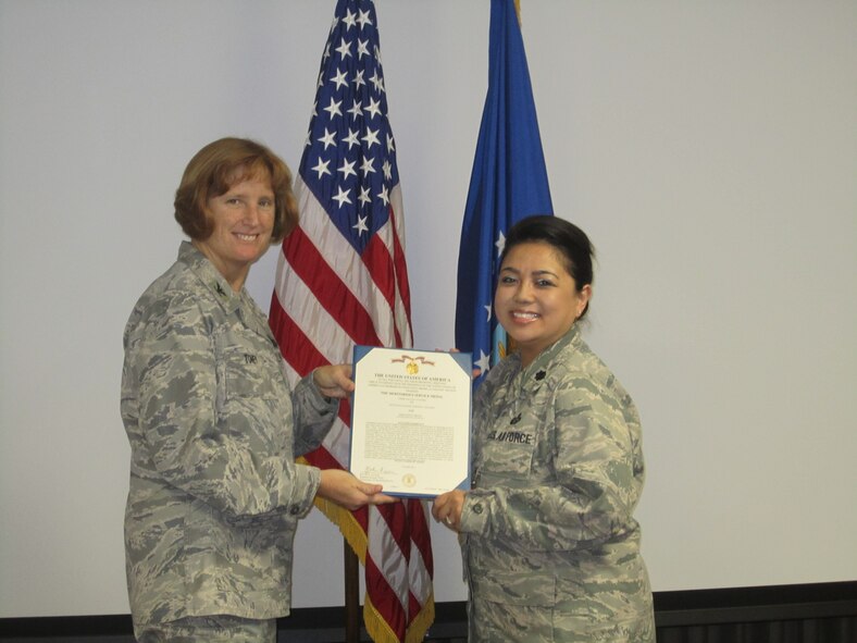 Col. Kimberly Toney, Air Force Recruiting Service vice commander, presents Lt. Col. Darwina Bugarin, AFRS Chief of Staff, with a Meritorious Service Medal recently. (USAF photo/courtesy photo)