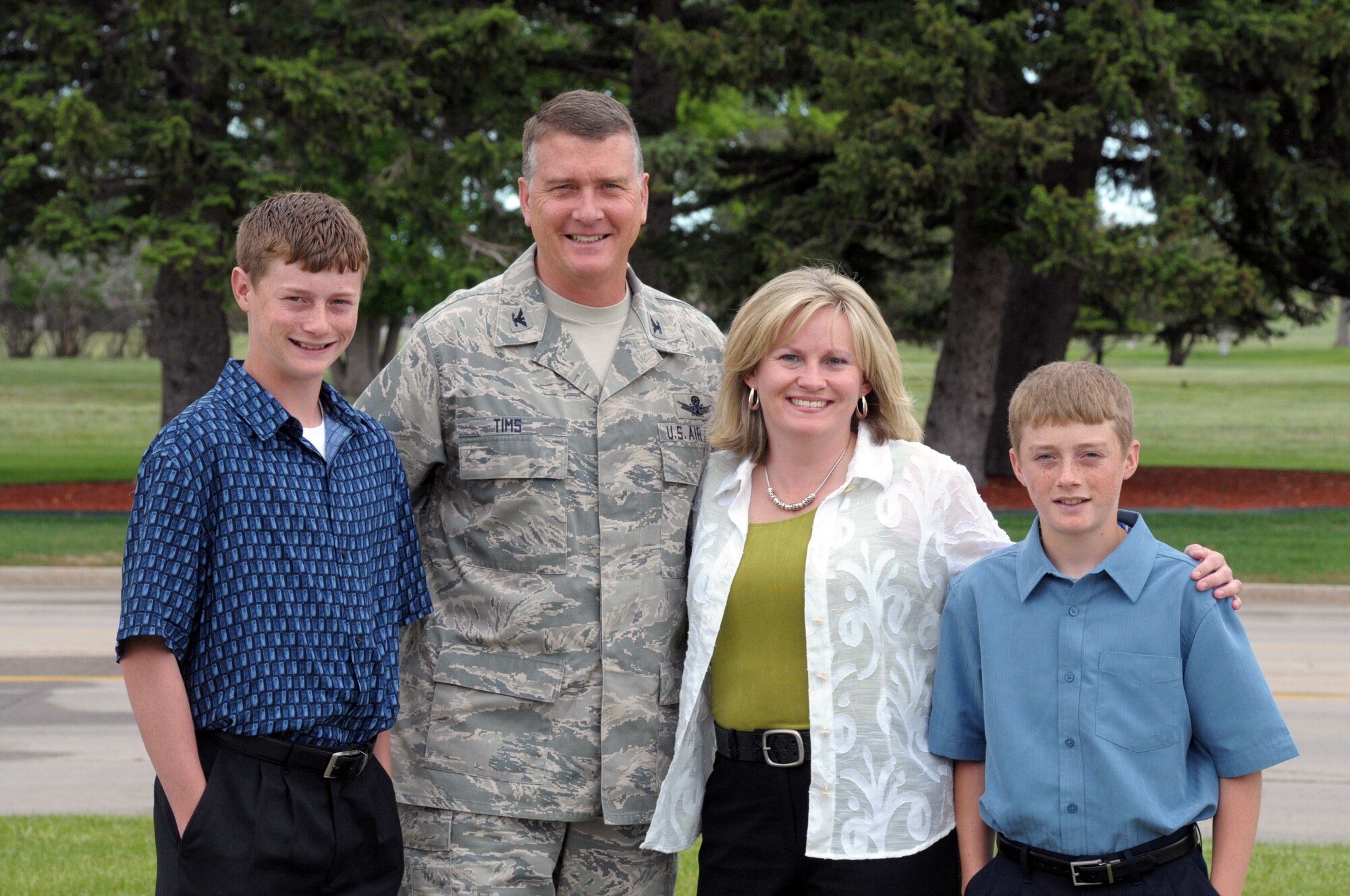 Col. Greg Tims, 90th Missile Wing commander, poses for a family photo with his wife Julie and sons Brian and Kevin June 10. (U.S. Air Force photo by Blaze Lipowski)