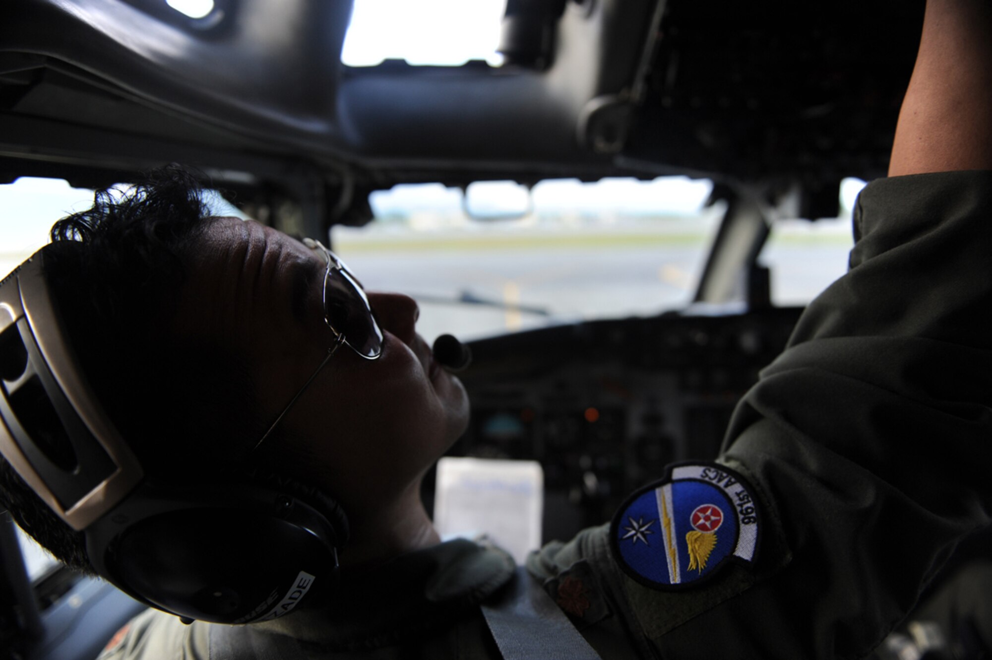 JOINT BASE ELMENDORF- RICHARDSON, Alaska -- Air Force Maj. Ryan Isokane, E-3 Sentry Airborne Warning and Control System aircraft commander, performs pre-flight checks before a training mission during Exercise Northern Edge 11 in JBER, Alaska, June 22, 2011. Northern Edge, Alaska's largest military training exercise, is designed to prepare joint forces to respond to crises throughout the Asia-Pacific region. (U.S. Navy photo/Mass Communication Specialist 2nd Class Rufus Hucks)