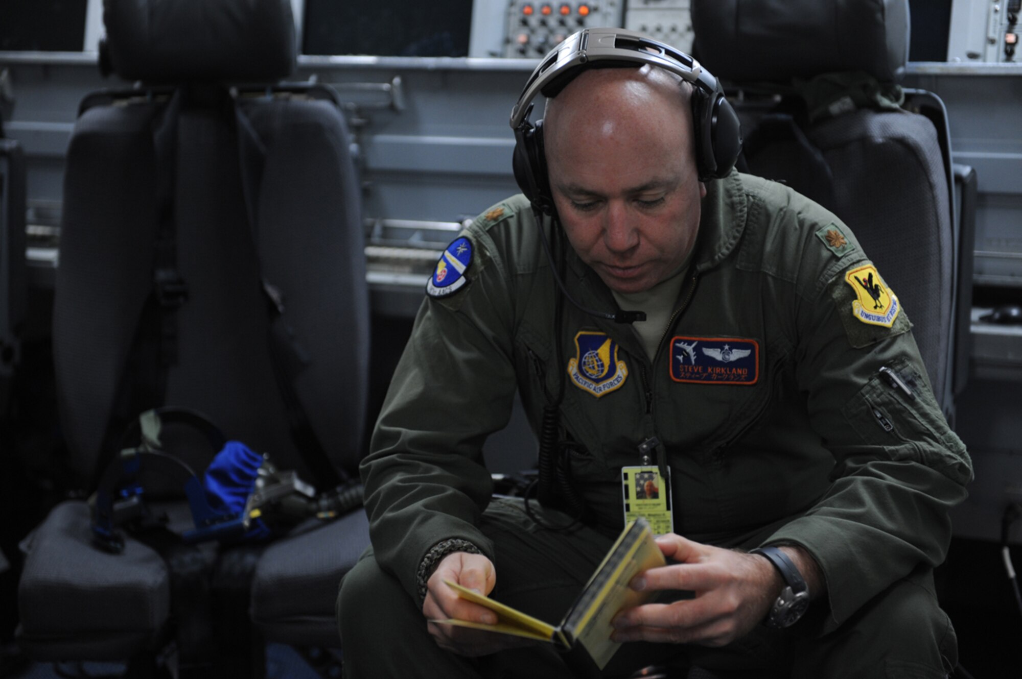 JOINT BASE ELMENDORF- RICHARDSON, Alaska -- Air Force Maj. Steven Kirkland, E-3 Sentry Airborne Warning and Control System mission control commander, performs pre-flight checks before a training mission during Exercise Northern Edge 11 in JBER, Alaska, June 22, 2011. Northern Edge, Alaska's largest military training exercise, is designed to prepare joint forces to respond to crises throughout the Asia-Pacific region. (U.S. Navy photo/Mass Communication Specialist 2nd Class Rufus Hucks)