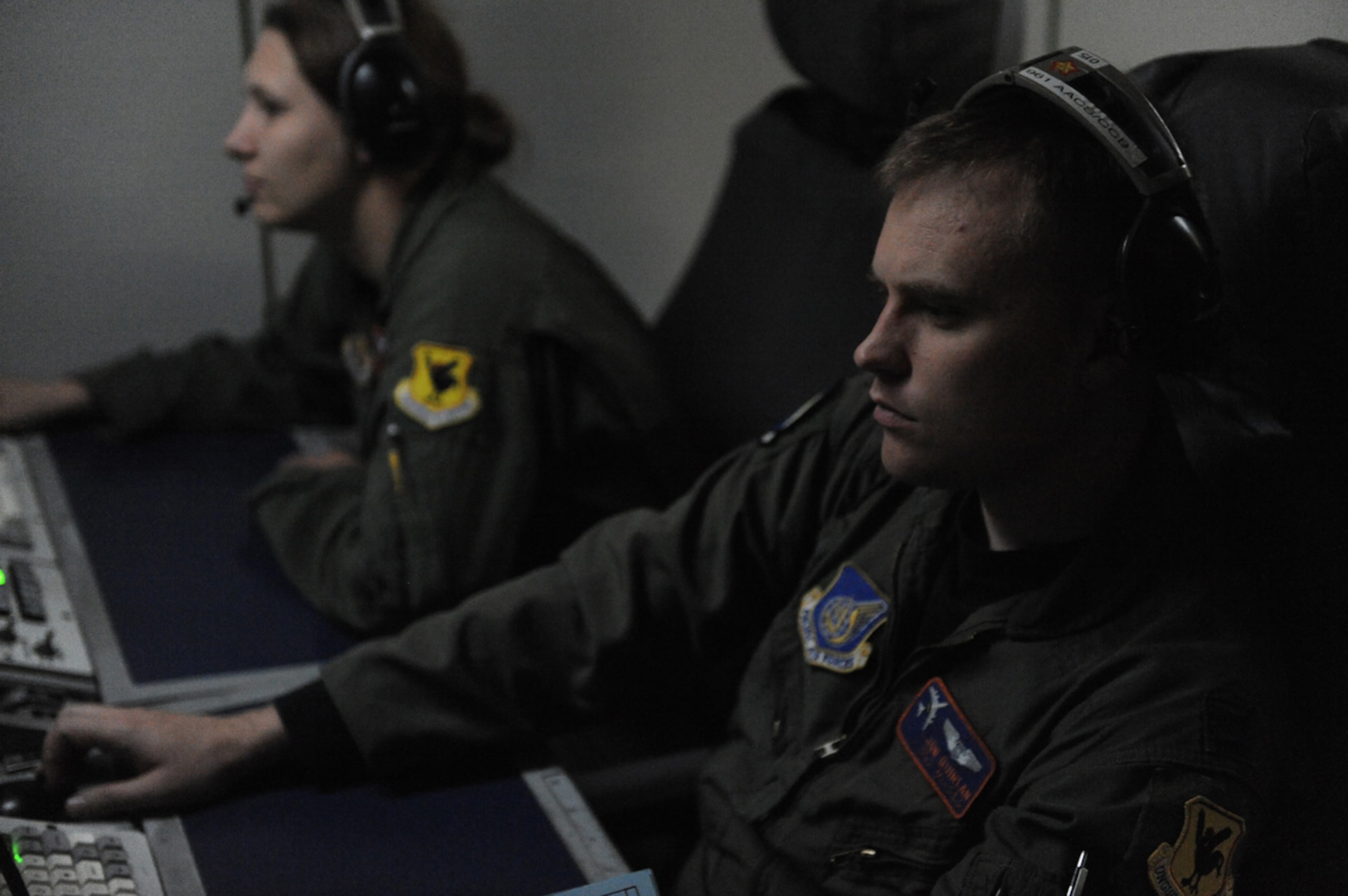 JOINT BASE ELMENDORF- RICHARDSON, Alaska -- AIr Force Capt. Jon Quinlan, E-3 Sentry Airborne Warning and Control System air surveillance officer, monitors airspace during a training mission during Exercise Northern Edge 11 in JBER, Alaska, June 22, 2011. Northern Edge, Alaska's largest military training exercise, is designed to prepare joint forces to respond to crises throughout the Asia-Pacific region. (U.S. Navy photo/Mass Communication Specialist 2nd Class Rufus Hucks))