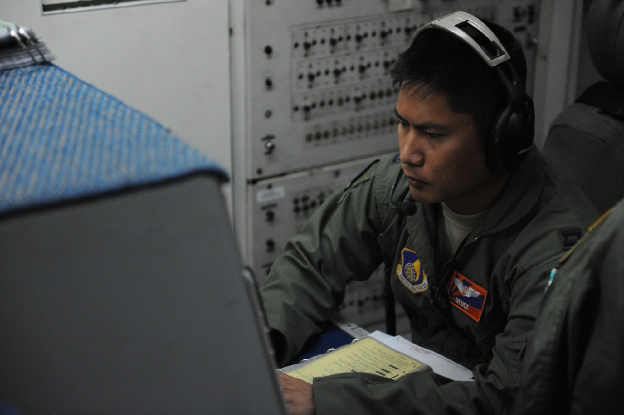 JOINT BASE ELMENDORF- RICHARDSON, Alaska -- Air Force Capt. Joel Doss, E-3 Sentry Airborne Warning and Control System crew member, monitors airspace during a training mission during Exercise Northern Edge 11 in JBER, Alaska, June 22, 2011. Northern Edge, Alaska's largest military training exercise, is designed to prepare joint forces to respond to crises throughout the Asia-Pacific region. (U.S. Navy photo/Mass Communication Specialist 2nd Class Rufus Hucks)