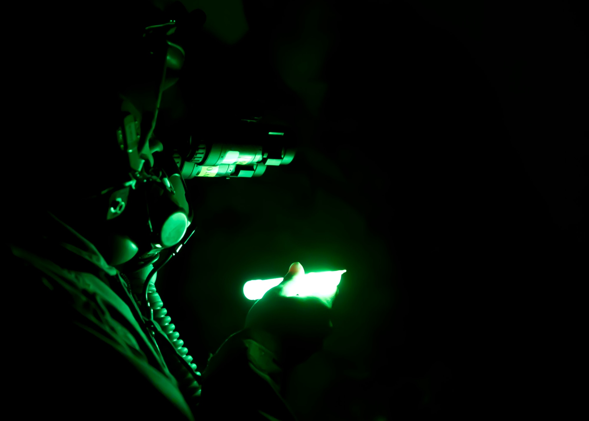 HOLLOMAN AIR FORCE BASE, N.M. -- A.J. Harrison, 16, who has spina bifida, utilizes night vision goggles, June 21, 2011, during his tour of the 7th Fighter Squadron Aircrew Flight Equipment Section. A.J. was given the opportunity to be a fighter pilot for a day with the 301st Fighter Squadron. He was provided a mission brief, AFE familiarization, and a pilot’s point of view in the cockpit of an F-22 Raptor. (U.S. Air Force photo by Airman 1st Class Joshua Turner/Released)