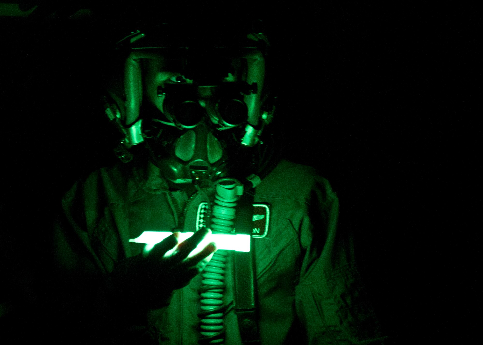 HOLLOMAN AIR FORCE BASE, N.M. -- A.J. Harrison, 16, who has spina bifida, utilizes night vision goggles, June 21, 2011, during his tour of the 7th Fighter Squadron Aircrew Flight Equipment Section. A.J. was given the opportunity to be a fighter pilot for a day with the 301st Fighter Squadron. He was provided a mission brief, AFE familiarization, and a pilot’s point of view in the cockpit of an F-22 Raptor. (U.S. Air Force photo by Airman 1st Class Joshua Turner/Released)