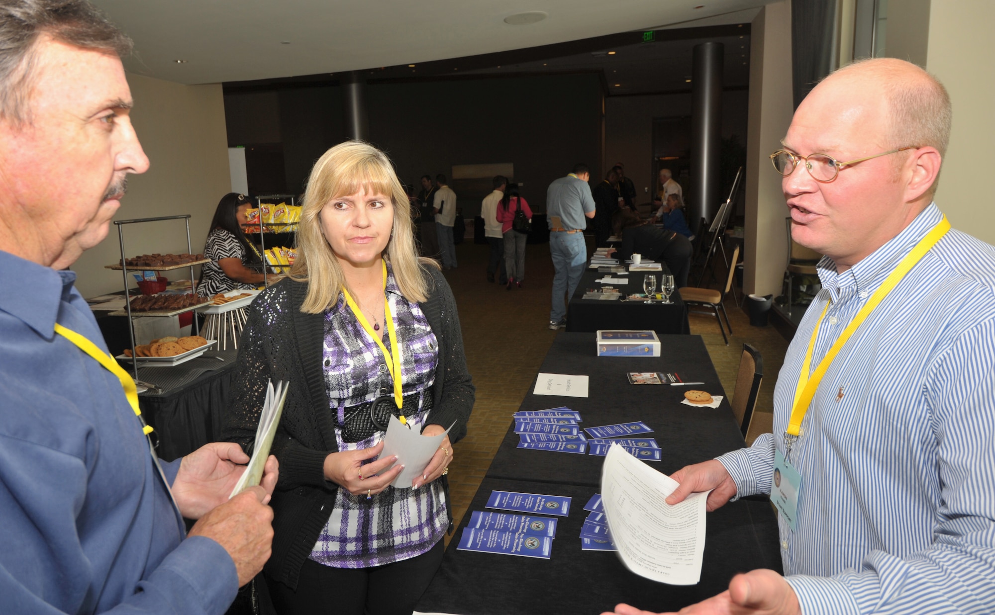 Capt. Aaron Haase, a JAG from the 310th Space Wing, counseled pre and post deployers during the western region Yellow Ribbon event at the Westin Hotel in Bellevue, Wash., June 11-12. Capt Haase, who works as a civilian JAG for the Air Force Academy, counseled deployers and their families on legal matter such as powers of attorney. (U.S. Air Force photo by Tech. Sgt. Scott P. Farley)