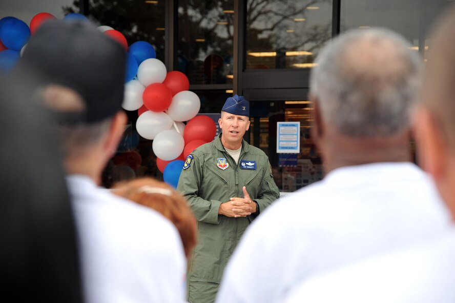 SEYMOUR JOHNSON AIR FORCE BASE, N.C.- Col. Patrick Doherty speaks to a crowd during the ribbon cutting ceremony for the Exchange grand re-opening here, June 23, 2011. Colonel Doherty thanked the Seymour Johnson community for their patience during  construction on the new and larger Exchange. The Exchange added 3,000 square feet to the sales floor, 4,000 square feet to the newly enclosed garden shop and opened a gun shop. Colonel Doherty is the 4th Fighter Wing commander. (U.S. Air Force photo by Senior Airman Whitney Lambert/Released)