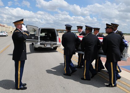 A U. S. Army honor guard escorts the remains of Army Staff Sgt. Nicholas Bellard at Randolph Air Force Base, Texas. Staff Sgt. Bellard, 26, was killed in Iraq June 13 from wounds suffered when enemy forces attacked his unit. He was assigned to 6th Squadron, 9th Cavalry Regiment, 3rd brigade Combat Team, 1st Cavalry Division, Fort Hood, Texas. His home of record is El Paso, Texas. (U.S. Air Force photo/Dave Terry)
