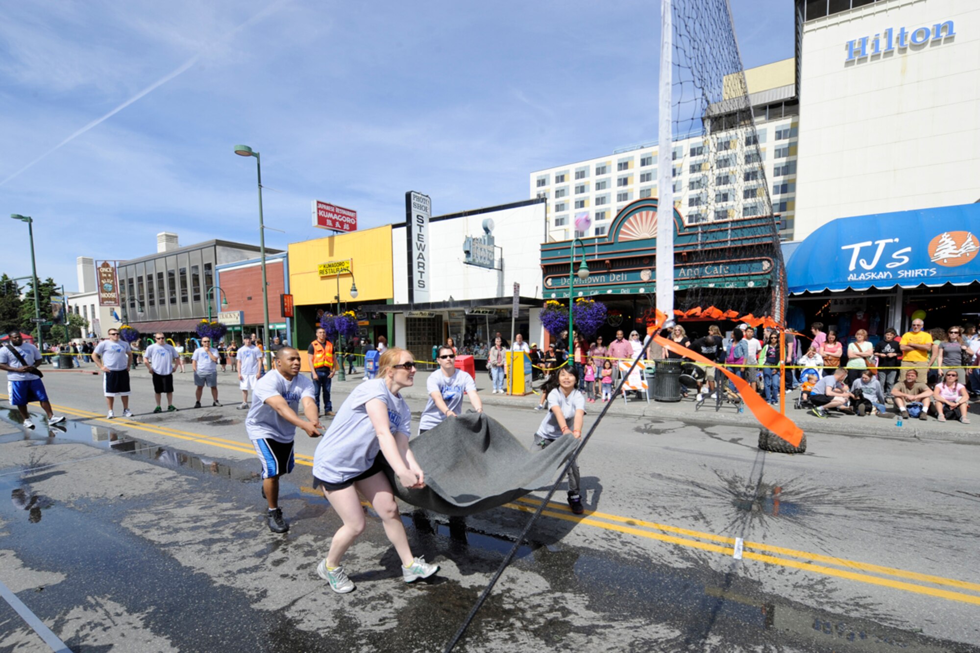 Team Arctic Falcons of the 673rd Medical Squadron from Joint Base Elmendorf-
Richardson try to catch a water-fi lled ballon as part of a volleyball game during
the Hero Games in downtown Anchorage. (U.S. Air Force photo\Steve White)