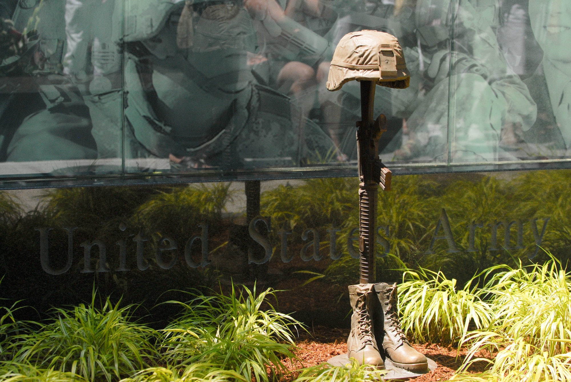 The New Hampshire Army Monument was unveiled on May 30, 2011 at the New Hampshire State Veterans Cemetery; the focal point of the monument is the “Battle Cross” – a bronze sculpture of combat boots, rifle and helmet. The helmet signifies the fallen Soldier; the inverted rife with bayonet signals a time for prayer, a break in the action to honor their comrade in arms; the combat boots represent the Soldier’s final march of the last battle. (U.S. Army photo by Staff Sgt. Nicole Dykstra/Released) 