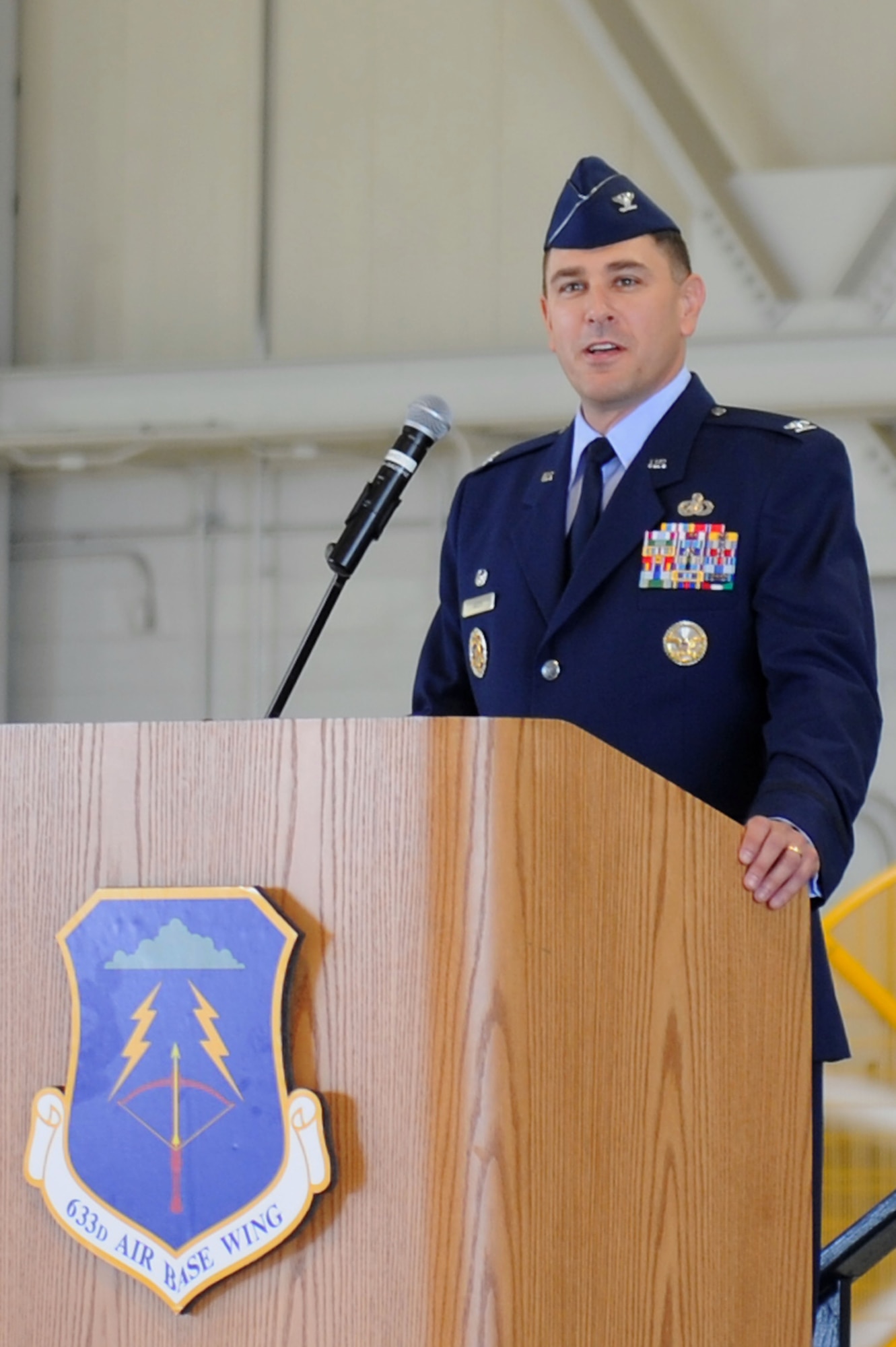 Col. Korvin Auch , 633d Air Base Wing commander, addresses the men and women during for the 633d Air Base Wing during a change of command ceremony at Langley Air Force Base, Va., June 23, 2011. Colonel Auch assumed command of the wing from Colonel Donald Kirkland. (U.S. Air Force photo by Airman 1st Class Kayla Newman/Released)
