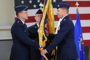 Col. Korvin Auch, 633d Air Base Wing commander, assumes command during the 633d change of command ceremony at Langley Air Force Base, Va., June 23, 2011. Colonel Auch succeeds Colonel Donald Kirkland as commander of the wing. (U.S. Air Force photo by Airman 1st Class Kayla Newman/Released)