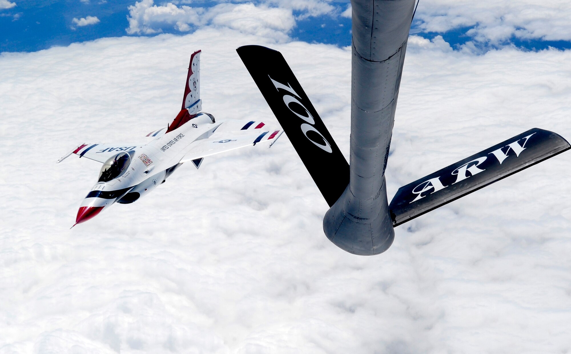 LATVIA, Northern Europe – One of the U.S Air Force Thunderbirds, a F-16 Fighting Falcon, flies out of position of a 100th Air Refueling Wing KC-135 Stratotanker after being refueled June 22, 2011. The Thunderbirds were refueled so that they could continue their air show performance in Latvia. (U.S. Air Force photo/Senior Airman Ethan Morgan)