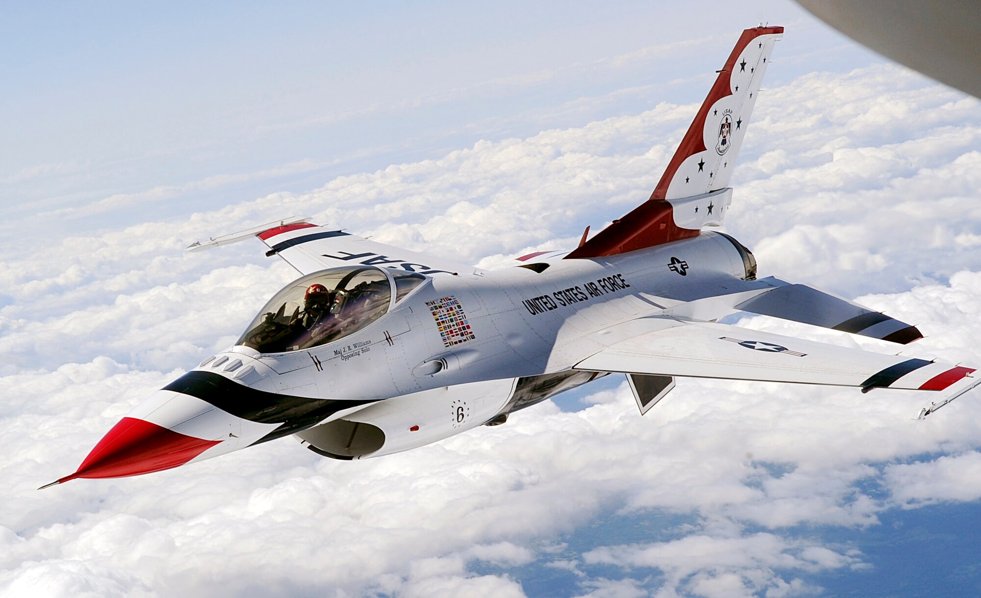 LATVIA, Northern Europe – One of the U.S Air Force Thunderbirds, a F-16 Fighting Falcon, flies into position to be refueled by a 100th Air Refueling Wing KC-135 Stratotanker June 22, 2011. The Thunderbirds received refueling support from the 100th ARW during their air show performance in Latvia. (U.S. Air Force photo/Senior Airman Ethan Morgan)