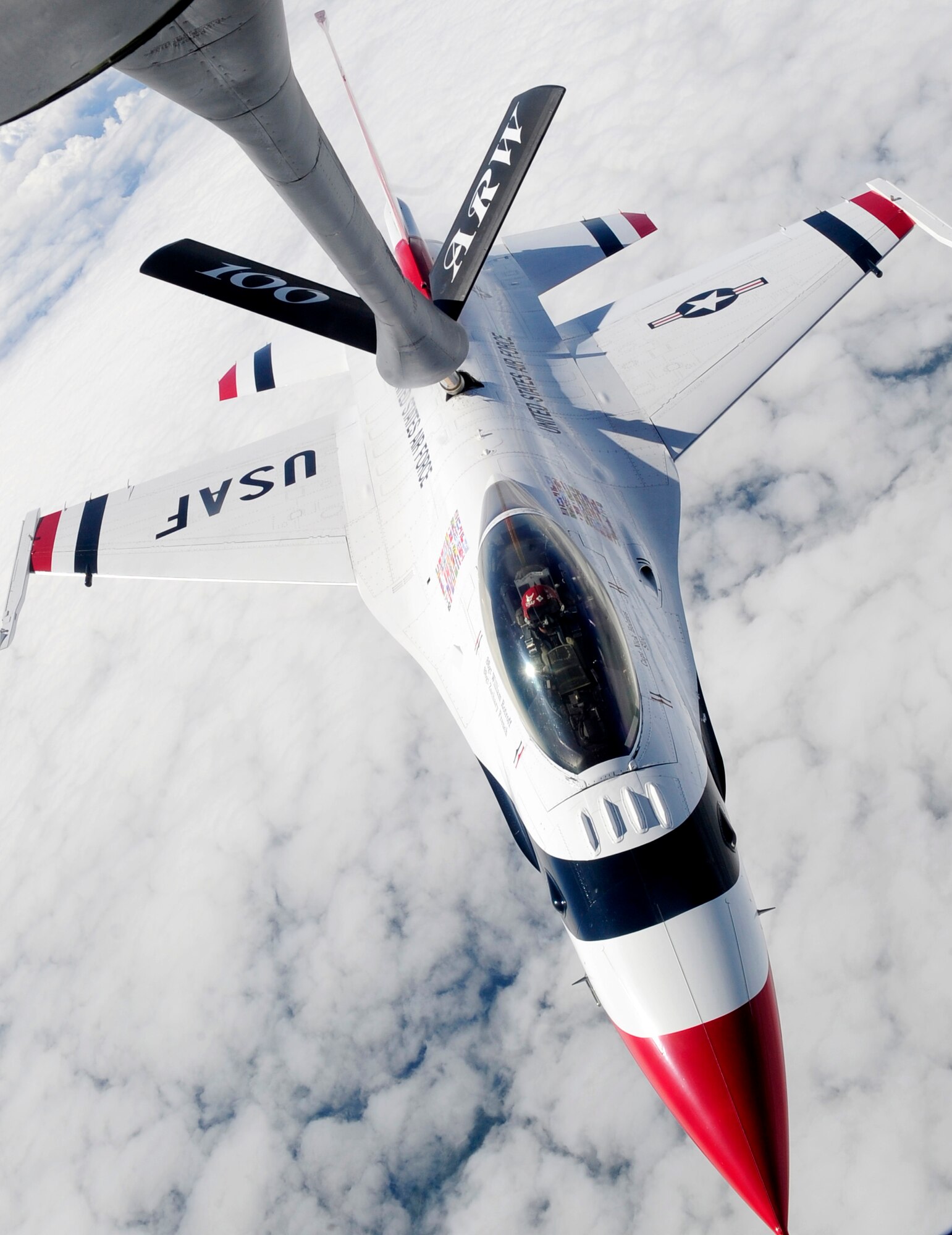 LATVIA, Northern Europe – One of the U.S Air Force Thunderbirds, a F-16 Fighting Falcon, receives gas from a 100th Air Refueling Wing KC-135 Stratotanker June 22, 2011. A total of six Thunderbirds were refueled during their air show performance in Latvia. (U.S. Air Force photo/Senior Airman Ethan Morgan)