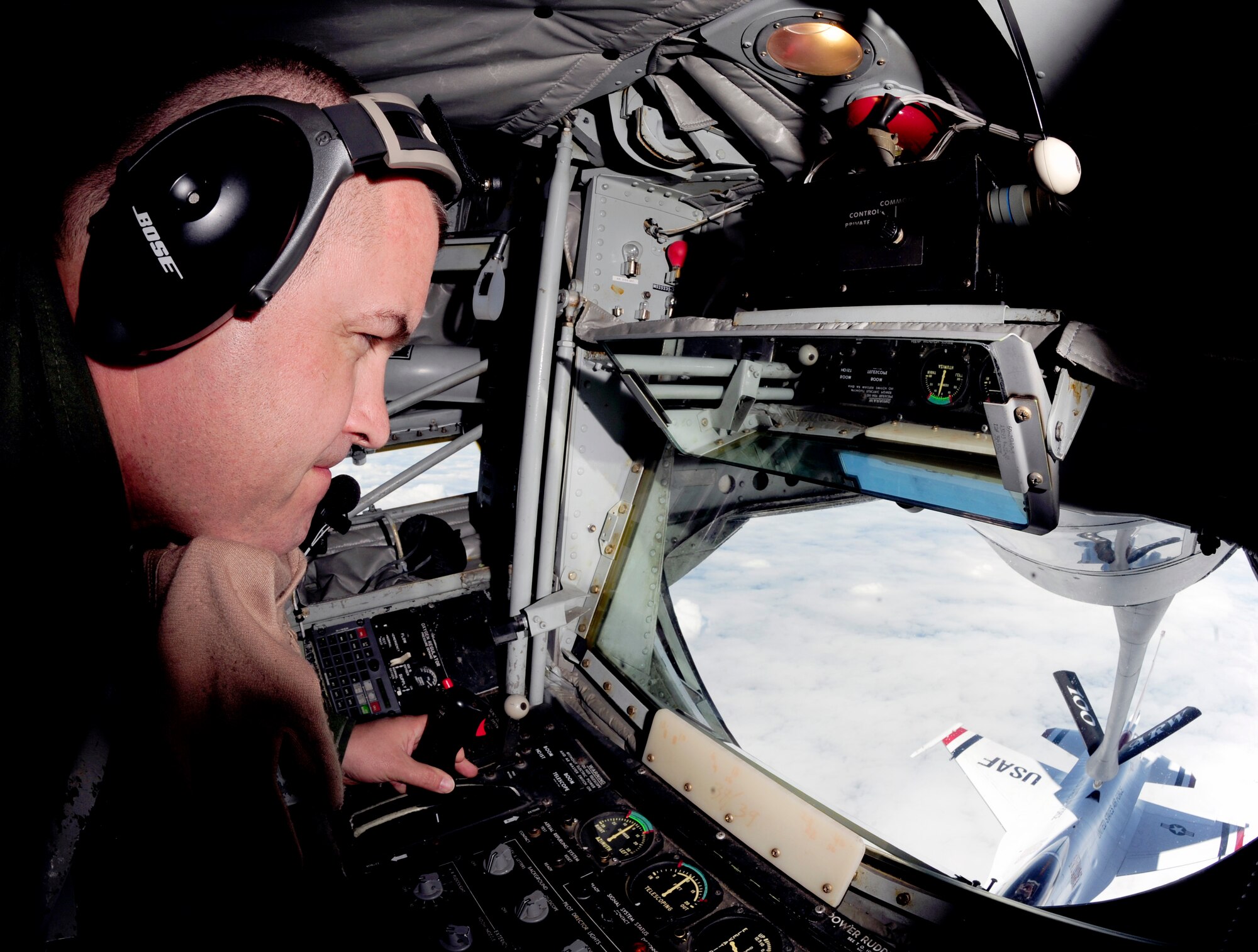LATVIA, Northern Europe – Senior Master Sgt. Paul Wallace, 351st Air Refueling Squadron boom operator, connects the boom of a 100th Air Refueling Wing KC-135 Stratotanker to one of the U.S Air Force Thunderbirds, a F-16 Fighting Falcon, June 22, 2011. Sergeant Wallace is responsible for guiding in each plane and ensuring that they are refueled as safely and quickly as possible. (U.S. Air Force photo/Senior Airman Ethan Morgan)