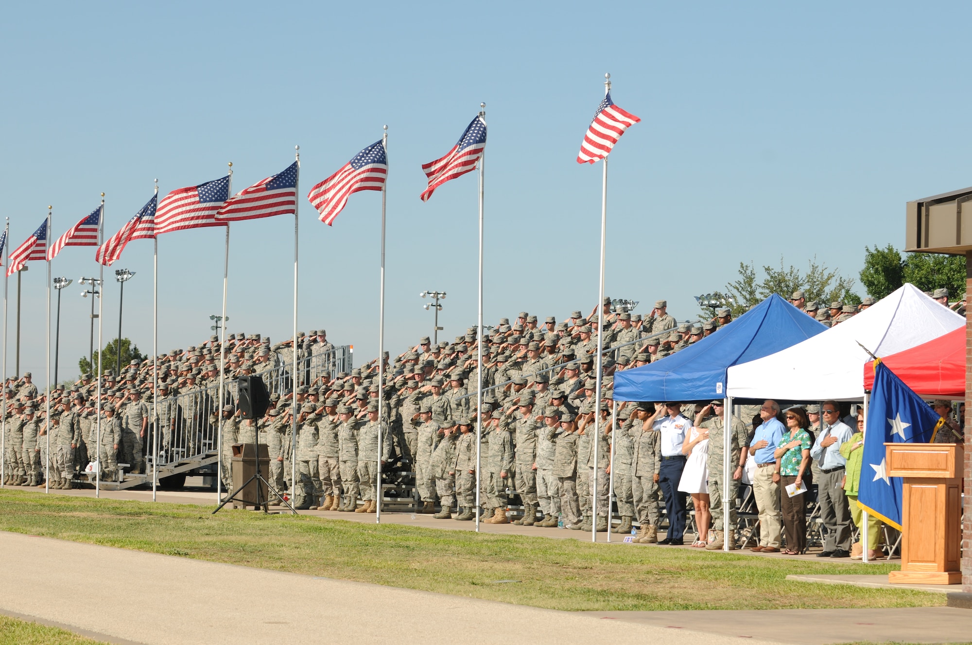 GOODFELLOW AIR FORCE BASE, Texas - Team Goodfellow members salute during the singing of the National Anthem at the 17th Training Wing Change of Command ceremony June 23. (U.S. Air Force photo/Staff Sgt. Heather L. Rodgers)
