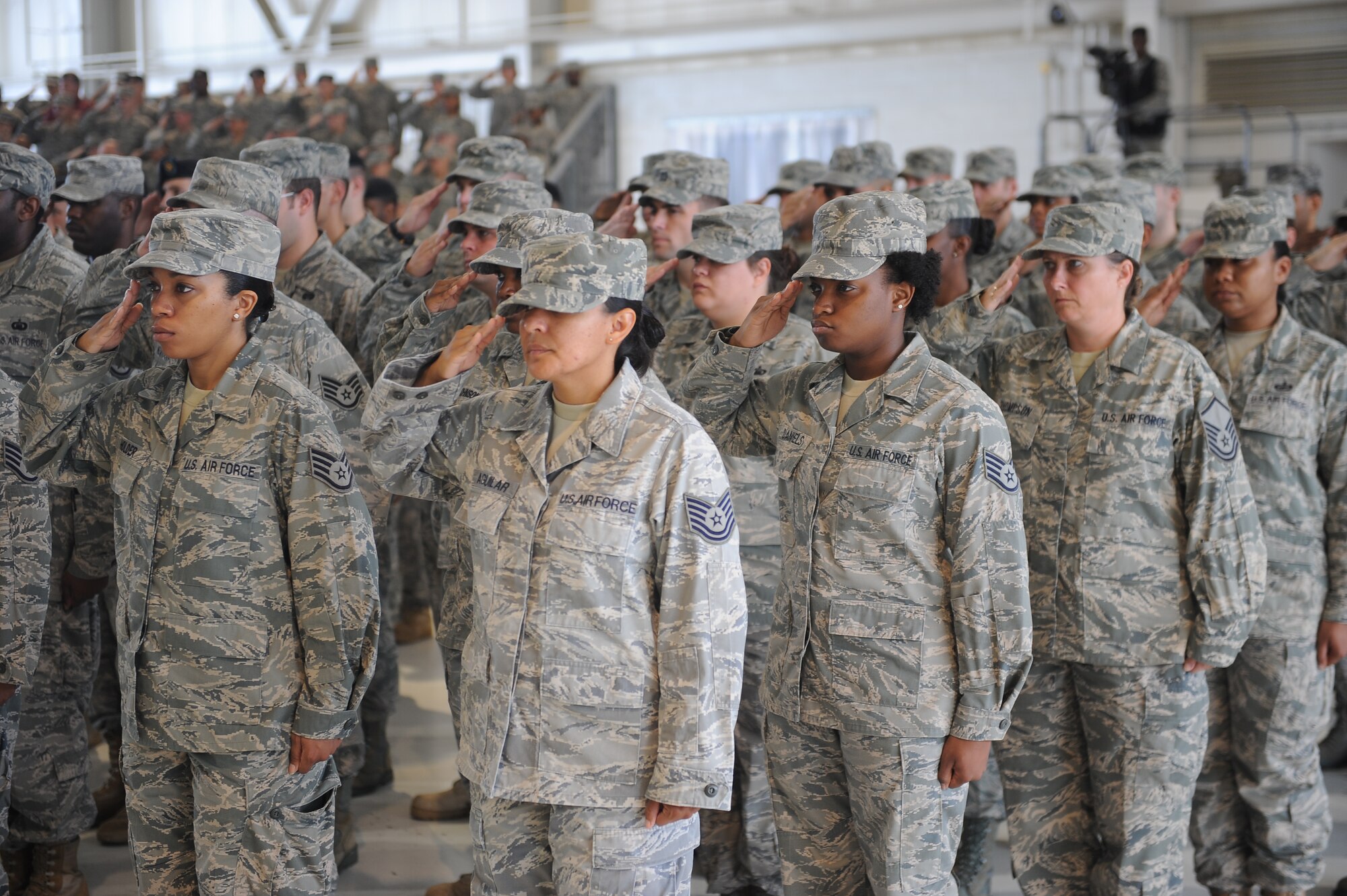 During the 633d change of command ceremony, Airman salute the incoming commander at Langley Air Force Base, Va., June 23, 2011. Col. Korvin Auch succeeds Col. Donald Kirkland as commander of the wing. (U.S. Air Force photo by Staff Sgt. Antoinette Gibson/Released)

