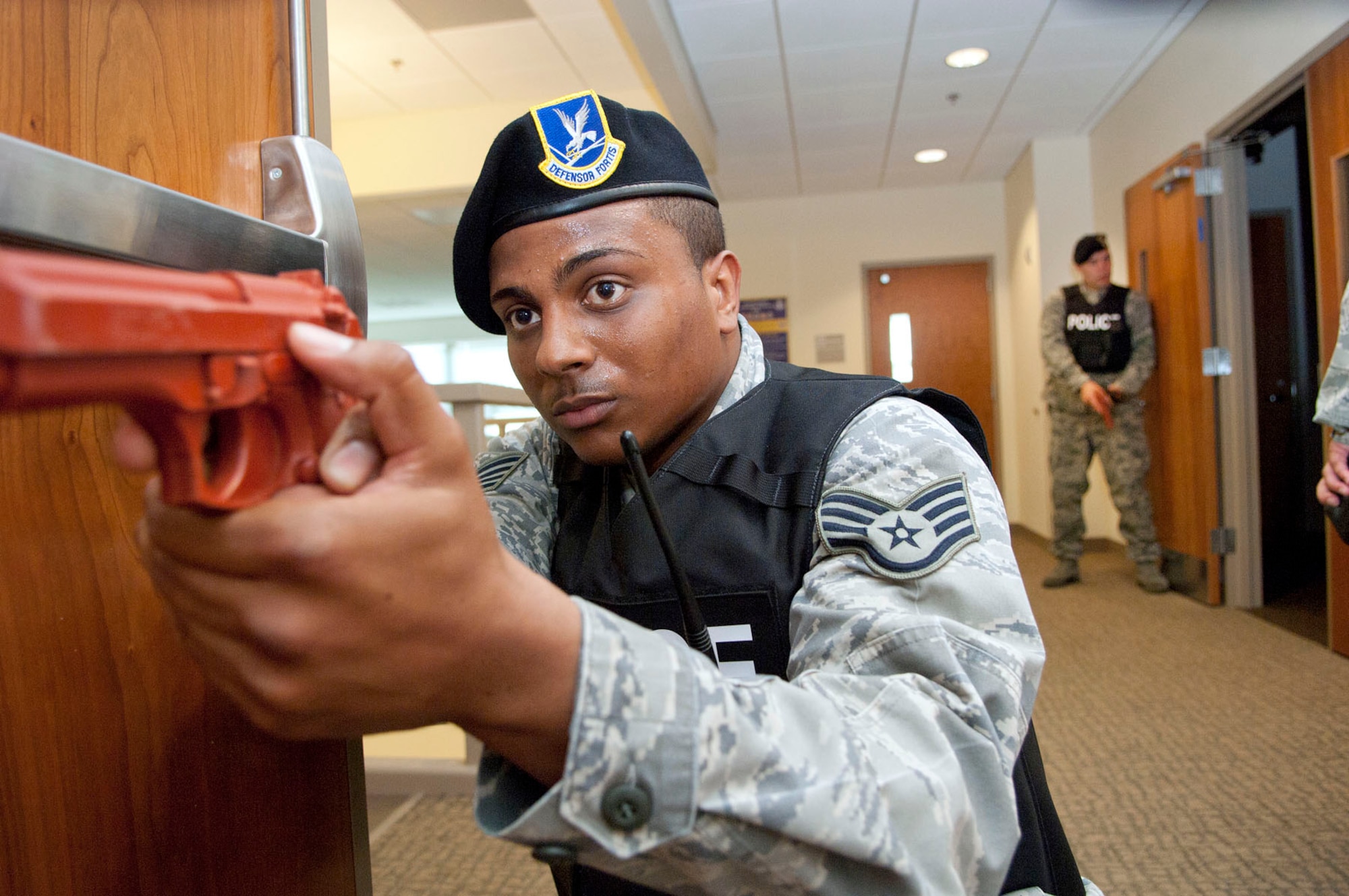 HANSCOM AIR FORCE BASE, Mass. - Staff Sgt. Daniel Vasquez secures an area as 66th Security Forces Squadron personnel secure Building 1604 during an active shooter exercise June 16. The 66th Security Forces Squadron responded to the active shooter incident as part of the Base Readiness Exercise last week. (U.S. Air Force photo by Mark Wyatt)