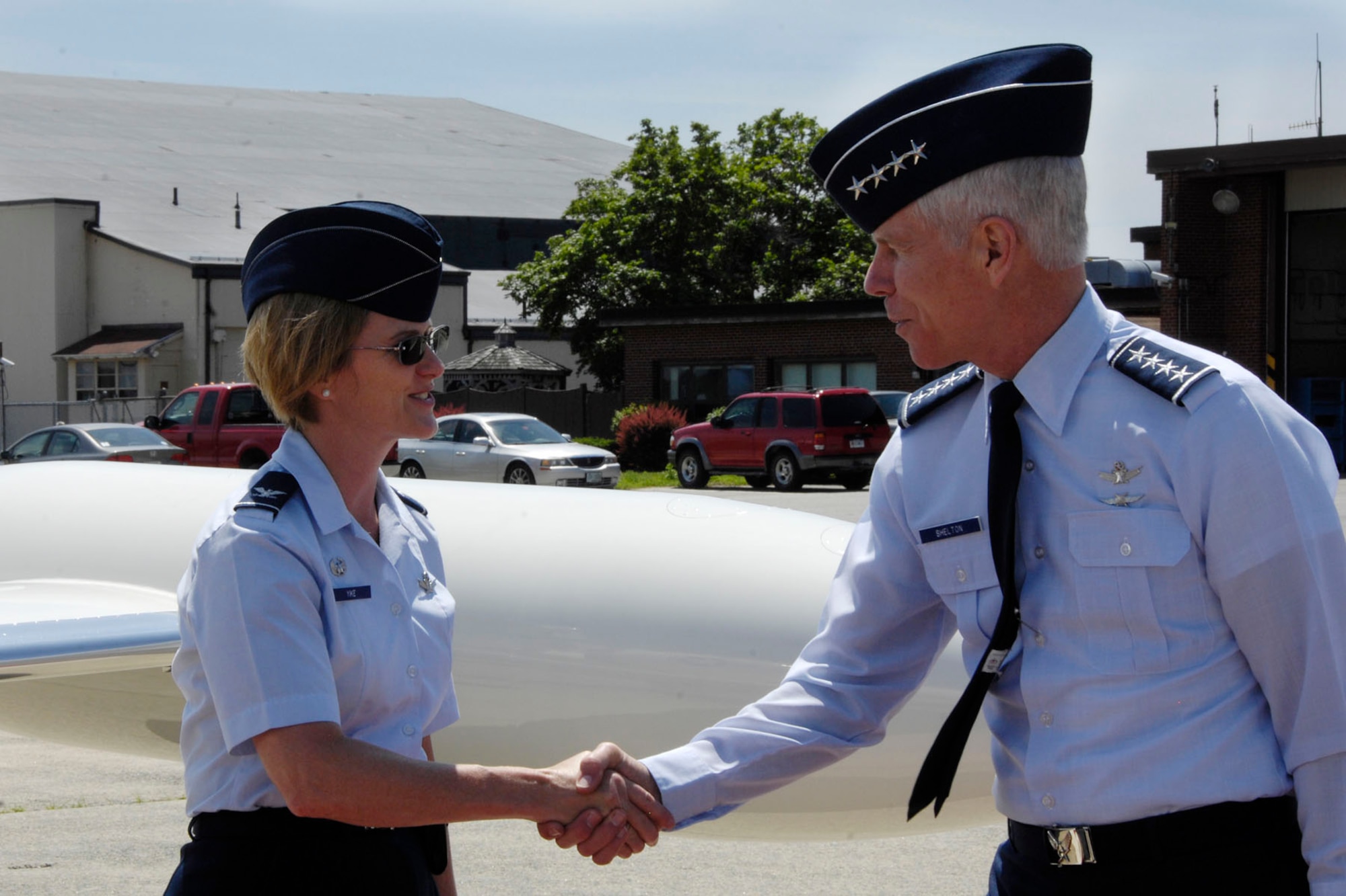 HANSCOM AIR FORCE BASE, Mass. – Gen. William Shelton (right), Air Force Space Command commander, shakes hands with Col. Stacy L. Yike, 66th Air Base Group commander, as he departs from Hanscom June 20. During his visit, the general met with senior leaders to discuss space surveillance at MIT Lincoln Laboratory. (U.S. Air Force photo by Linda LaBonte Britt)