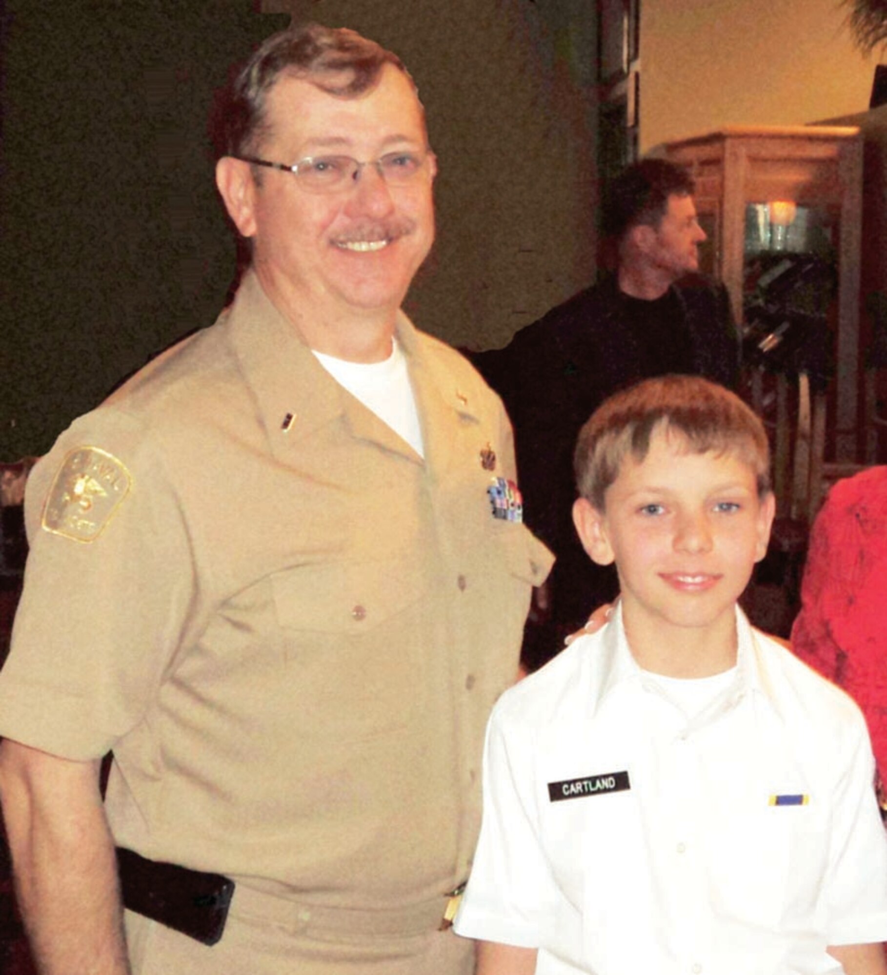 U.S. Air Force Tech. Sgt. Gordon "Tony" Cartland poses with his son, a Naval Sea Cadet. Sergeant Cartland is a reservist with the 452nd Aircraft Maintenance Squadron at March Air Reserve Base, Calif., and volunteers as the operations officer for his son's Sea Cadet unit in Northern Phoenix, Ariz. (Courtsey photo)                 