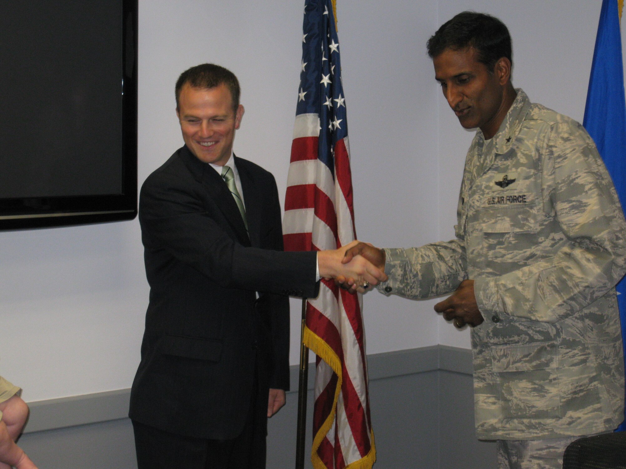 Brig. Gen. Balan Ayyar, Air Force Recruiting Service commander (right), commissioned a dental corps applicant, David Brockbank (left), during his visit to the 369th Recruiting Service Health Professionals office. Brockbank is participating in the Air Force Dental Health Professions Scholarship Program. (USAF photo/courtesy photo)