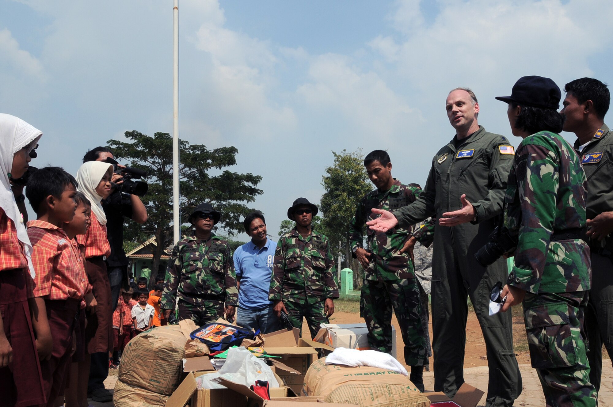 BINGUANG DISTRICT, Indonesia -- Lt. Col. Pete Kelley, Commander of the Cope West 11 detachment from Yokota Air Base, Japan, speaks to students from the Negri Warakas No. 3 Elementary School in Binguang district, Indonesia, June 23, 2011. Yokota Airmen delivered more than $1,200 worth of school supplies and sports equipment to the school during a goodwill visit. (U.S. Air Force photo/Capt. Raymond Geoffroy)