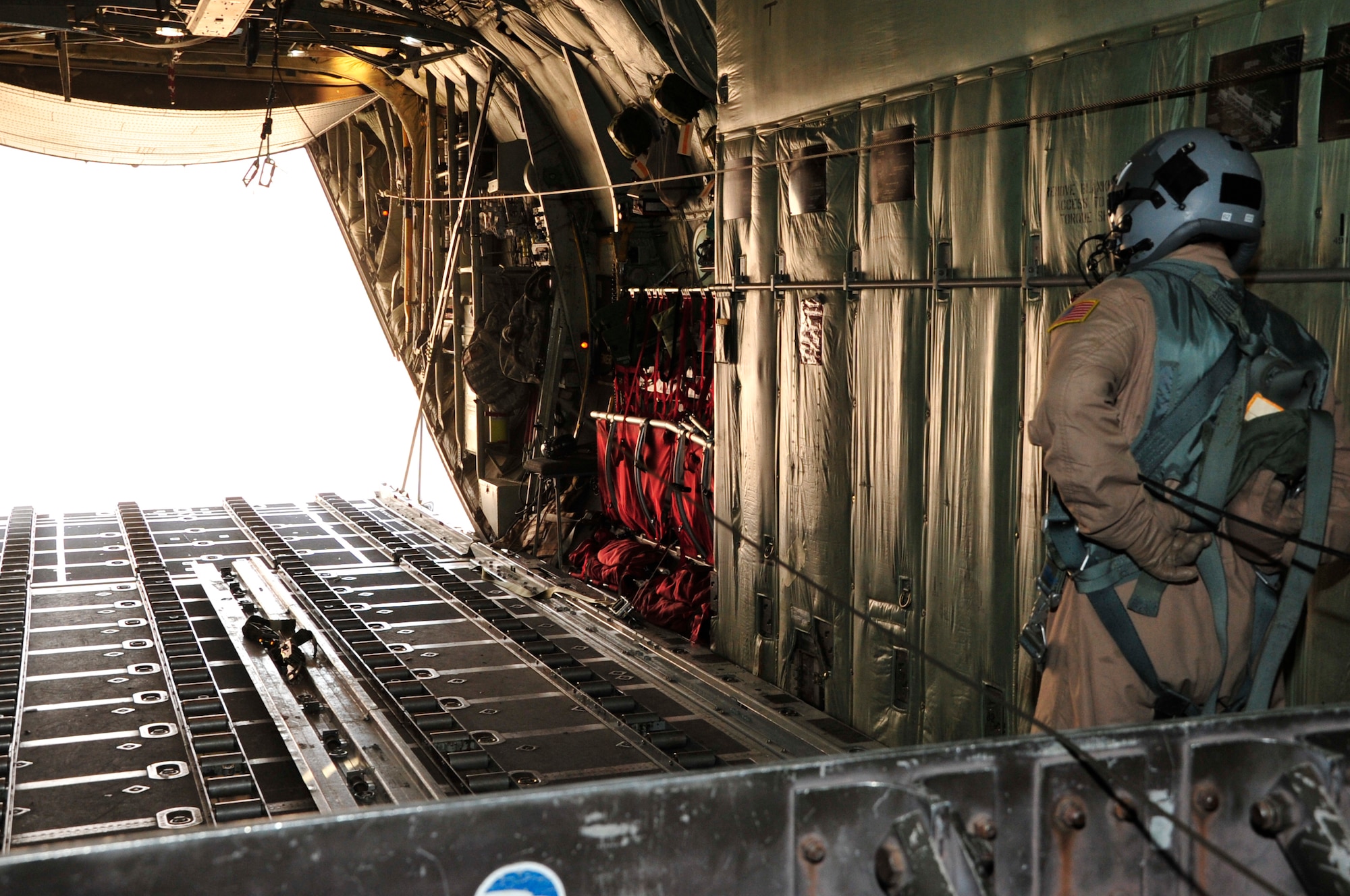 BAGRAM AIRFIELD, Afghanistan -- A loadmaster from the New York Air National Guard prepares to close the rear door of a C-130 Hercules aircraft after an airdrop to a forward operating base in Oruzgan Province, Afghanistan, June 22. The New York ANG C-130 flew the airdrop mission in conjunction with another C-130 from the Alaska ANG. Airdrops help mitigate the danger of transporting supplies via convoy. (U.S. Air Force photo by Capt. Korry Leverett)
