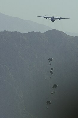  A C-130 Hercules from the New York Air National Guard airdrops much-needed supplies to a forward operating base in Oruzgan Province, Afghanistan, on June 22, 2011. The New York ANG C-130 flew the airdrop mission in conjunction with another C-130 from the Alaska ANG. Officials say airdrops help mitigate the danger of transporting supplies via convoy. (U.S. Air Force Photo/Senior Airman Krista Rose) 
