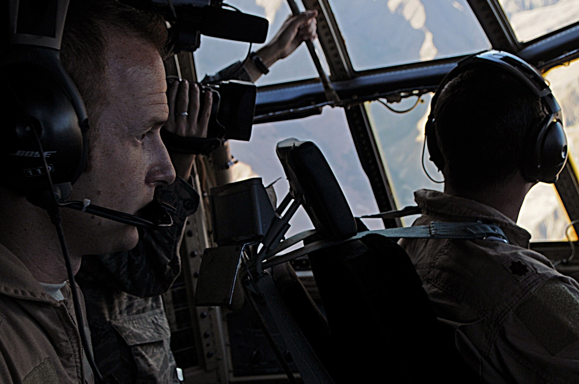 BAGRAM AIRFIELD, Afghanistan -- Tech. Sgt. James Castagna, 774th Expeditionary Airlift Squadron C-130 Hercules flight engineer at Bagram Airfield, Afghanistan, assists his pilot while flying aboard a C-130 with supplies for a forward operating base in Oruzgan Province, Afghanistan, June 22. Airdrops help mitigate the danger of transporting supplies via convoy. Sergeant Castagna is a member of the Alaska Air National Guard stationed at Joint Base Elmendorf-Richardson, Alaska. (U.S. Air Force photo by Senior Airman Krista Rose)