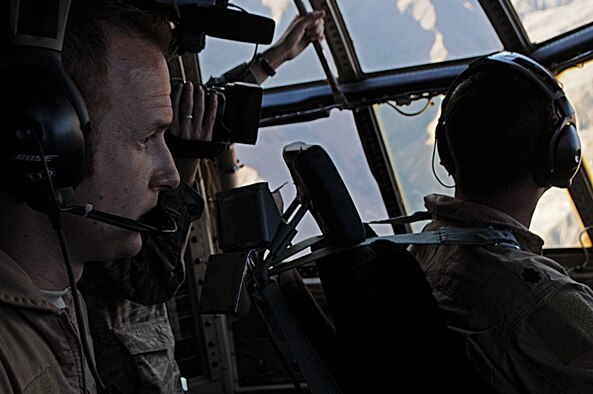 Tech. Sgt. James Castagna, 774th Expeditionary Airlift Squadron C-130 Hercules flight engineer at Bagram Airfield, Afghanistan, assists his pilot while flying aboard a C-130 with supplies for a forward operating base in Oruzgan Province, Afghanistan, on June 22, 2011. Officials say airdrops help mitigate the danger of transporting supplies via convoy. Sergeant Castagna is a member of the Alaska Air National Guard stationed at Joint Base Elmendorf-Richardson, Alaska. (U.S. Air Force Photo/Senior Airman Krista Rose)