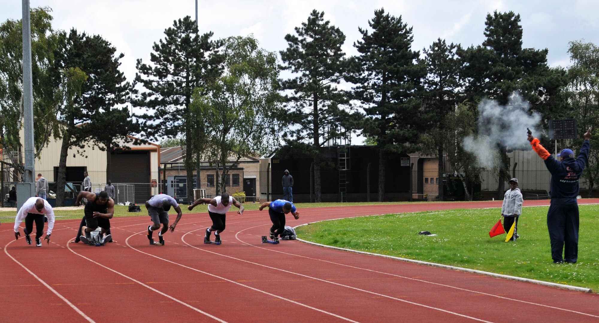 ROYAL AIR FORCE LAKENHEATH, England ? A group of athletes take off for the 100-meter dash at the first ever RAF Lakenheath Relays on June 18, 2011. Master Sgt. Khalid Mulazim, Ohio Air Force Reserve, won with a time of 11.31 seconds. The competition included track and field events such as the 100-meter dash, 800-meter relay, shot put and discus throw. The event provided Department of Defense personnel the opportunity to be selected to represent the Air Force at the annual Ramstein Allied Headquarters Command Athletics Championships in Europe. (U.S. Air Force photo/Senior Airman Tiffany M. Deuel)