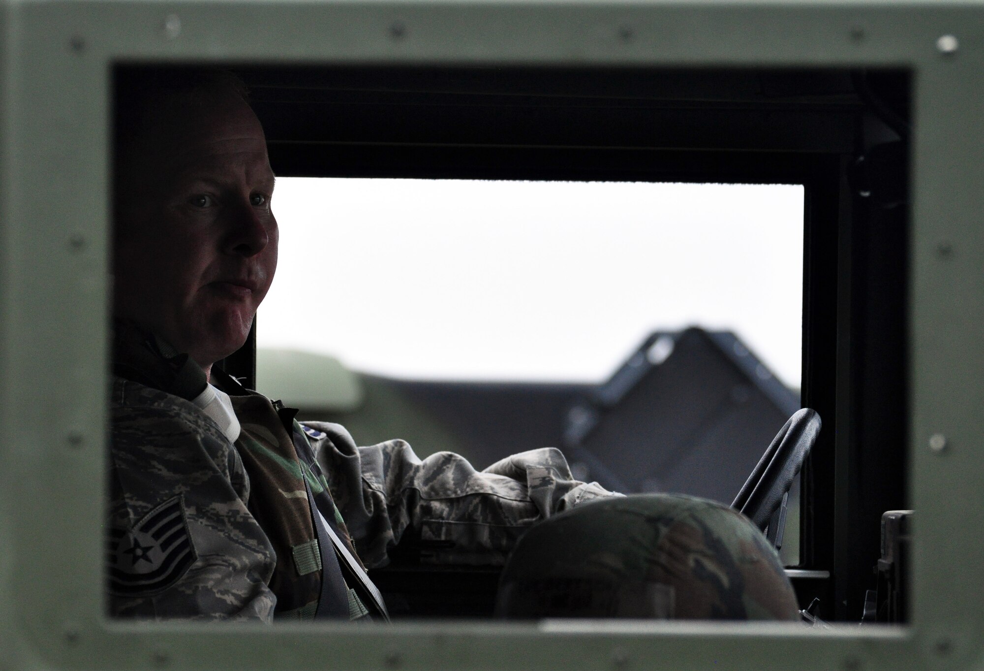 An Airman sits and waits in a Humvee after a tactical convoy training exercise. Approximately 150 Airmen from the 51st Civil Engineer Squadron participated in PRIME BEEF training June 22 at Osan. Prime BEEF forces have the necessary command, control and communications to support beddown; fire emergency services; emergency management; explosive ordnance disposal; expedient construction; explosive incident response; chemical, biological, radiological and nuclear response and other specialized mission areas. (U.S. Air Force photo/Staff Sgt. Chad Thompson)