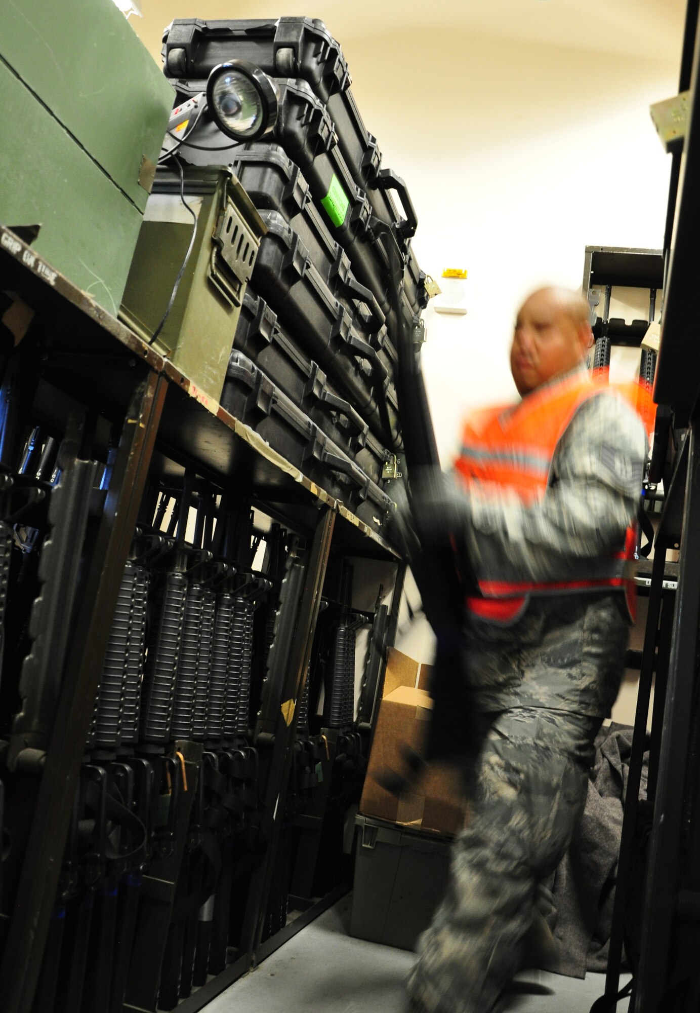 Tech. Sgt. Frederick Saulog, 51st Civil Engineer Squadron, Osan Air Base, Republic of Korea, hands out M-16s during CES monthly PRIME BEEF training. Approximately 150 Airmen from the 51st Civil Engineer Squadron participated in PRIME BEEF training June 22 at Osan. Prime BEEF forces have the necessary command, control and communications to support beddown; fire emergency services; emergency management; explosive ordnance disposal; expedient construction; explosive incident response; chemical, biological, radiological and nuclear response and other specialized mission areas. (U.S. Air Force photo/Staff Sgt. Chad Thompson)
