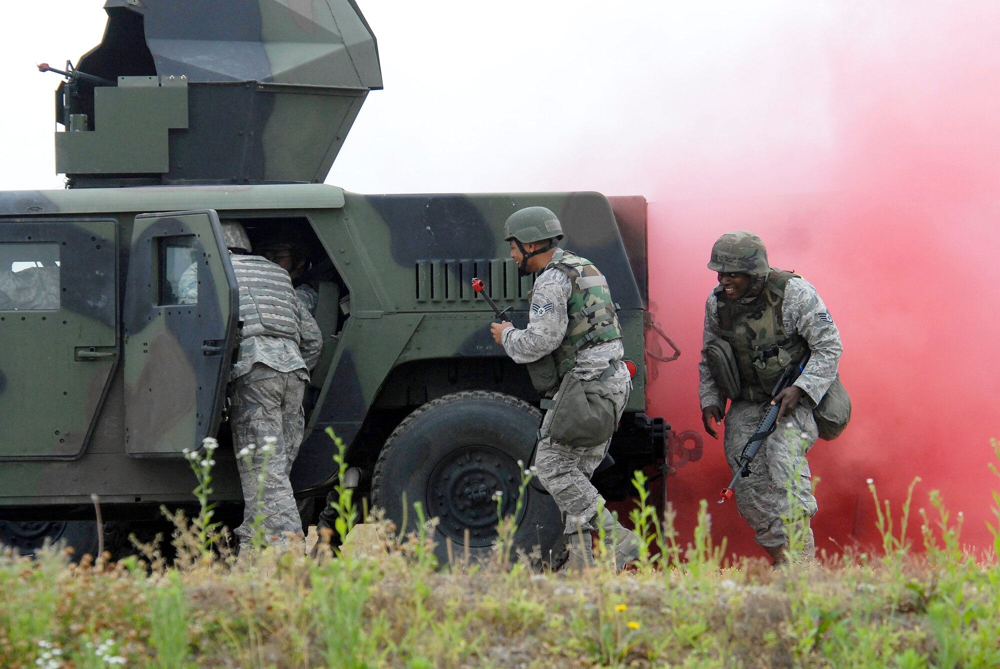 Airmen prepare to enter a functional Humvee after the one they were riding in was hit by a simulated improvised explosive device (IED). Approximately 150 Airmen from the 51st Civil Engineer Squadron participated in PRIME BEEF training June 22 at Osan. Prime BEEF forces have the necessary command, control and communications to support beddown; fire emergency services; emergency management; explosive ordnance disposal; expedient construction; explosive incident response; chemical, biological, radiological and nuclear response and other specialized mission areas. (U.S. Air Force photo/Senior Master Sgt. Paul Holcomb)