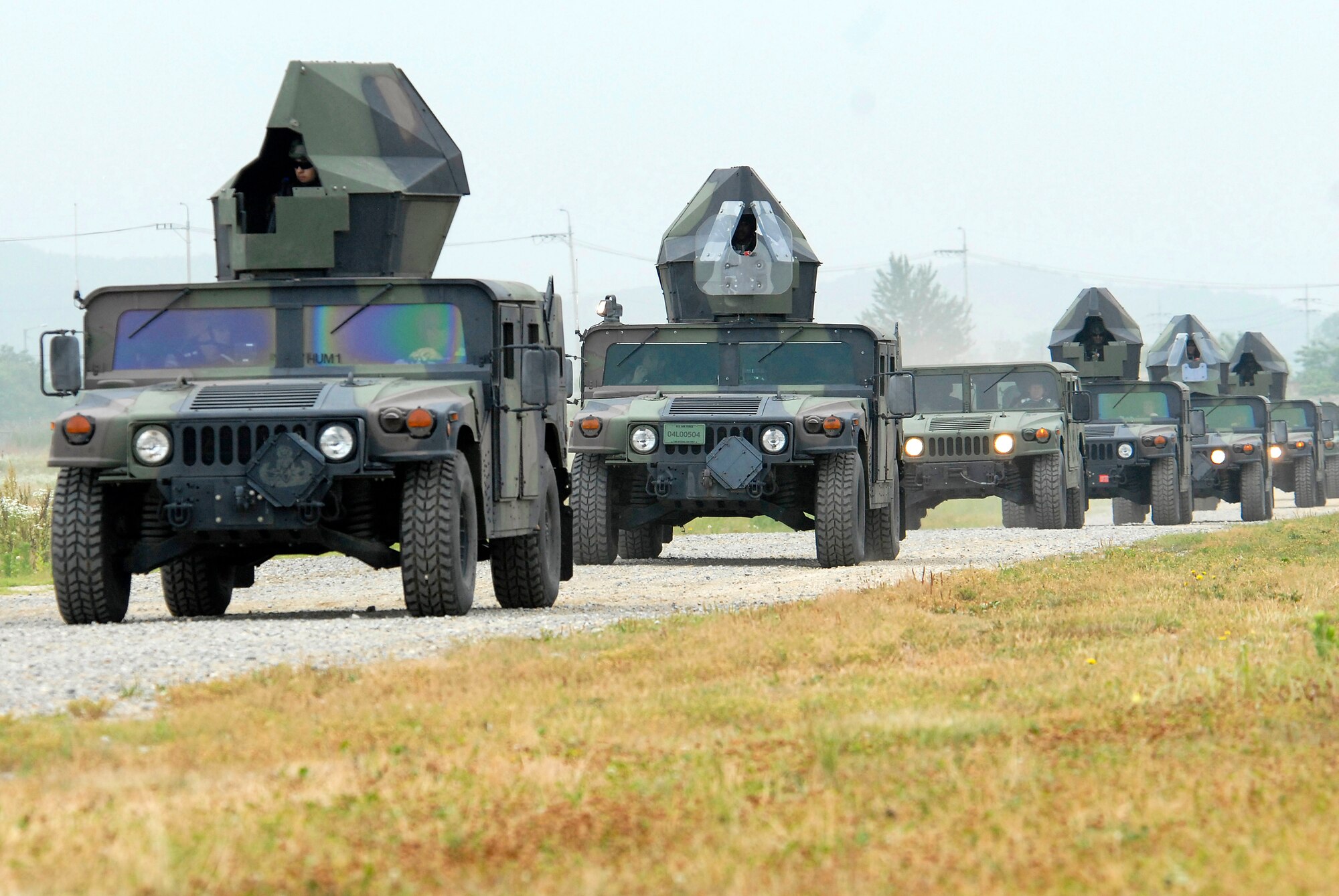 A convoy of Humvees travels down a gravel road on the northeast side of Osan Air Base, Republic of Korea. Approximately 150 Airmen from the 51st Civil Engineer Squadron participated in PRIME BEEF training June 22 at Osan. Prime BEEF forces have the necessary command, control and communications to support beddown; fire emergency services; emergency management; explosive ordnance disposal; expedient construction; explosive incident response; chemical, biological, radiological and nuclear response and other specialized mission areas.
 (U.S. Air Force photo/Senior Master Sgt. Paul Holcomb)