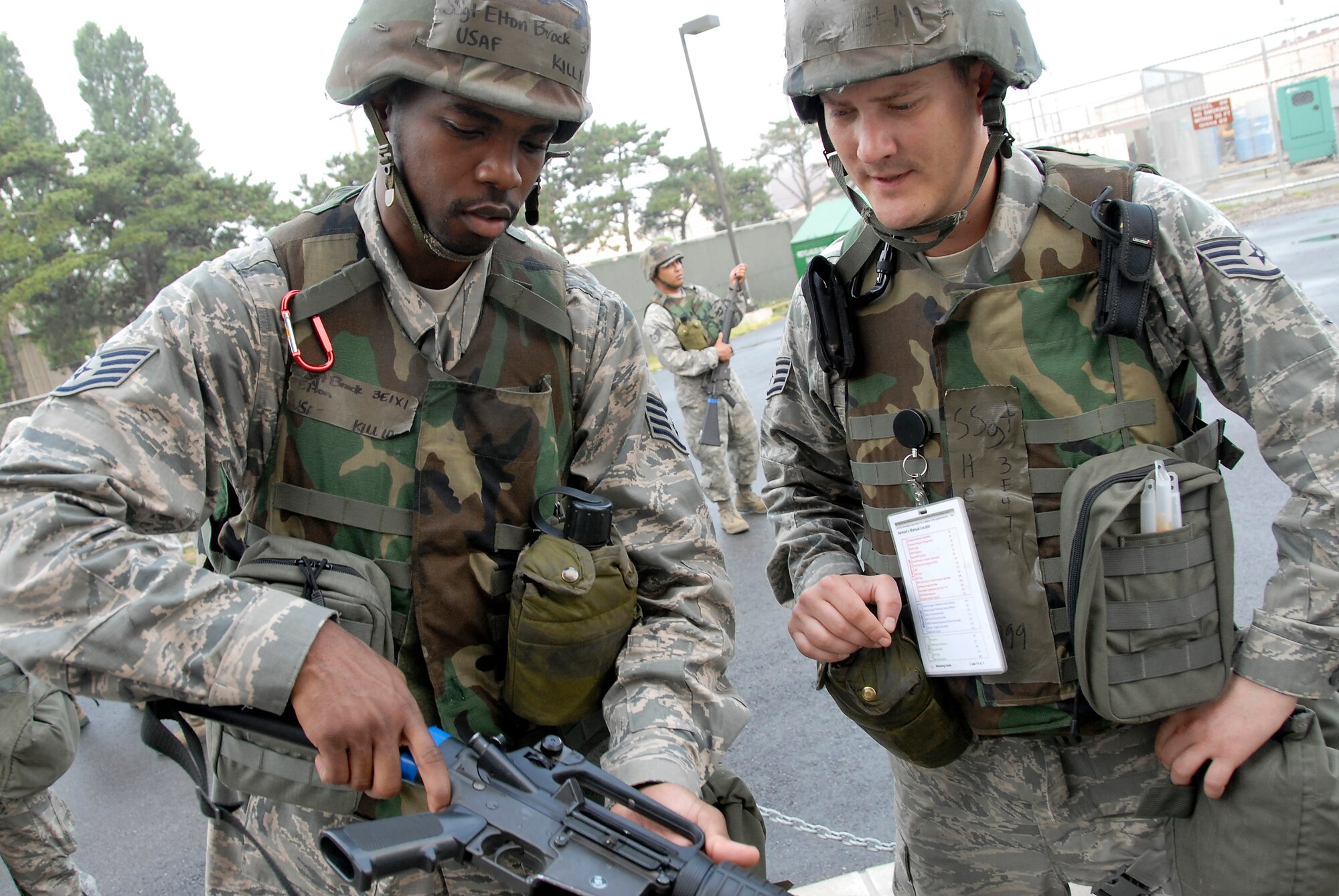Staff Sgt. Elton Brock, left, clears his M-16 rifle while Staff Sgt. Steven Herzog provides training guidance. Both Airmen are assigned to the 51st Civil Engineer Squadron, Osan Air Base, Republic of Korea. Approximately 150 Airmen from the 51st Civil Engineer Squadron participated in PRIME BEEF training June 22 at Osan. Prime BEEF forces have the necessary command, control and communications to support beddown; fire emergency services; emergency management; explosive ordnance disposal; expedient construction; explosive incident response; chemical, biological, radiological and nuclear response and other specialized mission areas. (U.S. Air Force photo/Senior Master Sgt. Paul Holcomb)