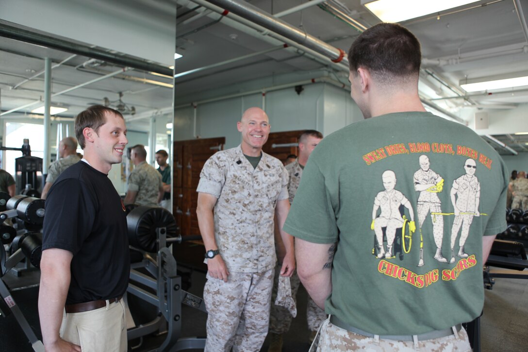 MARINE CORPS BASE CAMP LEJEUNE, N.C. - Sgt. Maj. Micheal P. Barrett, the 17th sergeant major of the Marine Corps, talks to a wounded warrior at the Wounded Warrior Battalion-East’s exercise room aboard Marine Corps Base Camp Lejeune, June 24. During his visit to the base, Barrett visited wounded warriors, Naval Hospital Camp Lejeune and also spoke to Marines and sailors during a town hall meeting in the Base Theater.