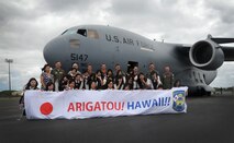 High school students from Sendai Japan pose for a photo in front of a C-17 Globemaster III during a base tour June 24. The students are from Sendai Ikuei Gakuen High School and are continuing their education in Hawaii while their homes and school are being rebuilt in Sendai, Japan. The students came to Joint Base Pearl Harbor-Hickam to tour the base and meet the C-17 crew who flew to Sendai following the earthquake and tsunami. (U.S. Air Force photo/Senior Airman Lauren Main)