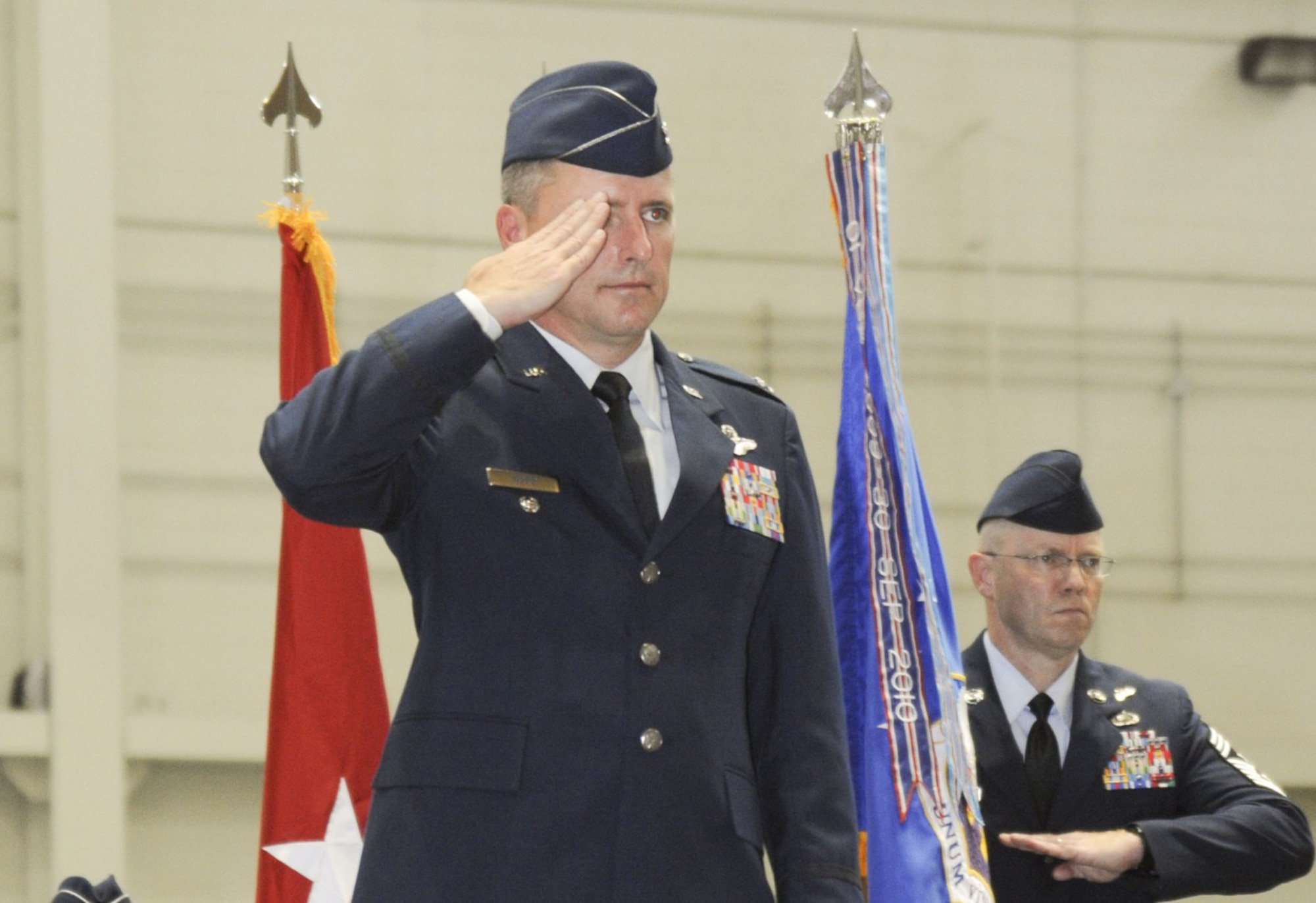 Col. John M. Wood conducts his first salute during the 87th Air Base Wing Change of Command Ceremony on June 24, 2011 in Hangar 2201 at Joint Base McGuire-Dix-Lakehurst, N.J. During the event Brig. Gen. Gina M. Grosso relinquished command to Col. John M. Wood. 

(U.S. Air Force photo by 2nd Lt. David J. Murphy/released)