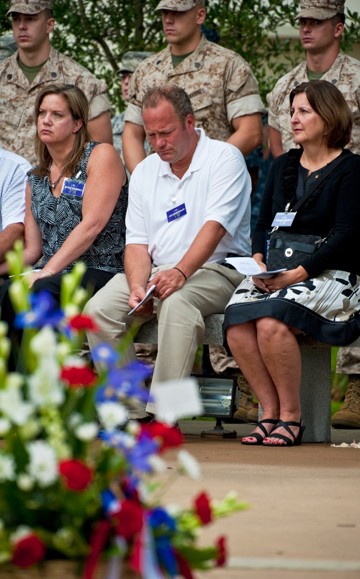 Family members of victims of the Khobar Towers bombing observe a moment of silence at the Khobar Towers memorial ceremony June 24, 2011, at Eglin Air Force Base, Fla. June 25 marks the 15th anniversary of the bombing that killed 19 service members including 12 33rd FW Airmen. (U.S. Air Force photo/Samuel King Jr.)