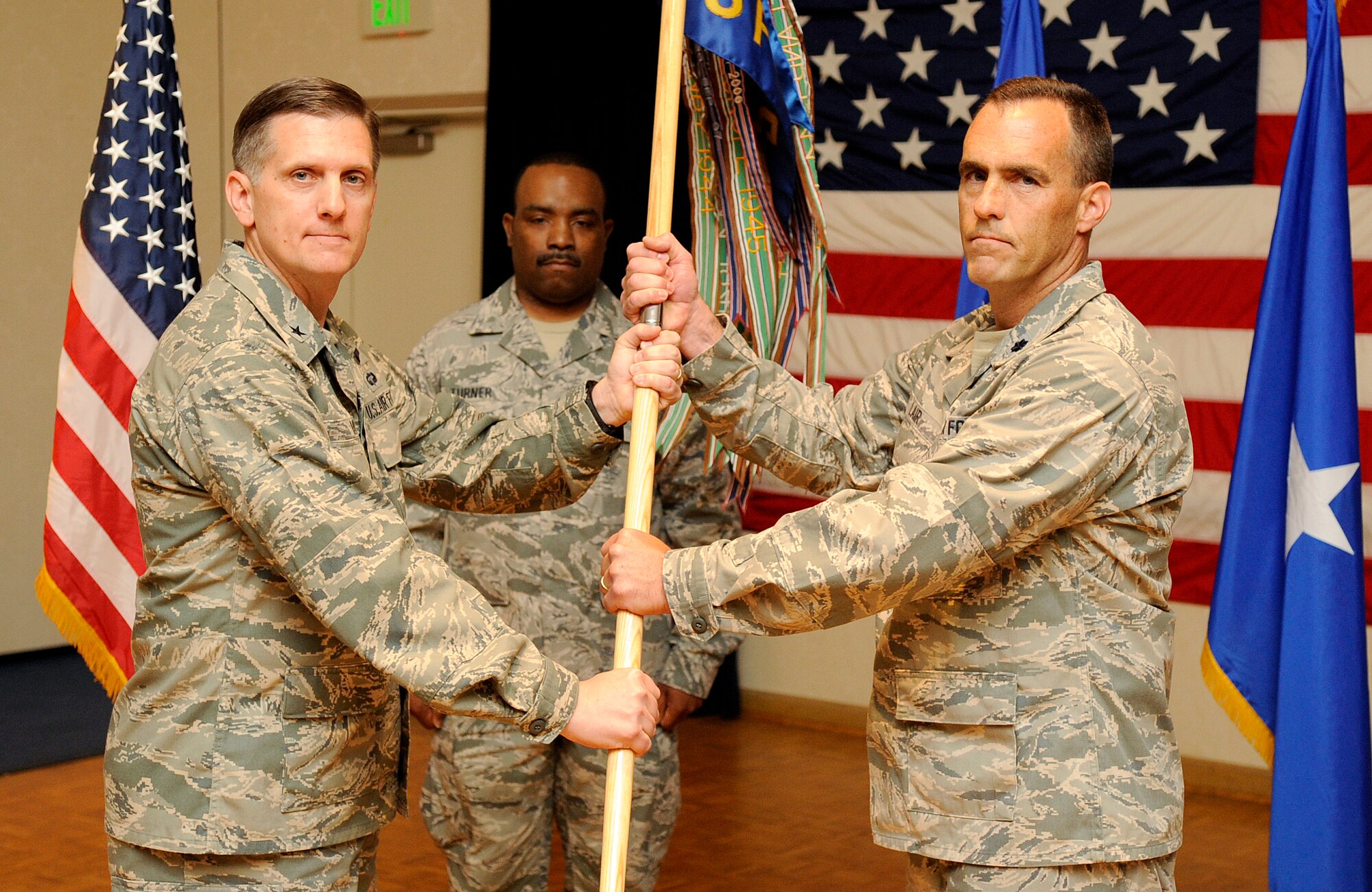 VANDENBERG AIR FORCE BASE, Calif. – Lt. Col. David W. Lair, the 576th Flight Test Squadron commander, accepts the guidon from Brig. Gen. Timothy M. Ray, Headquarters Air Force Global Strike Command director of operations, at the Pacific Coast Club here Friday, June 24, 2011. (U.S. Air Force photo/Senior Airman Andrew Lee)